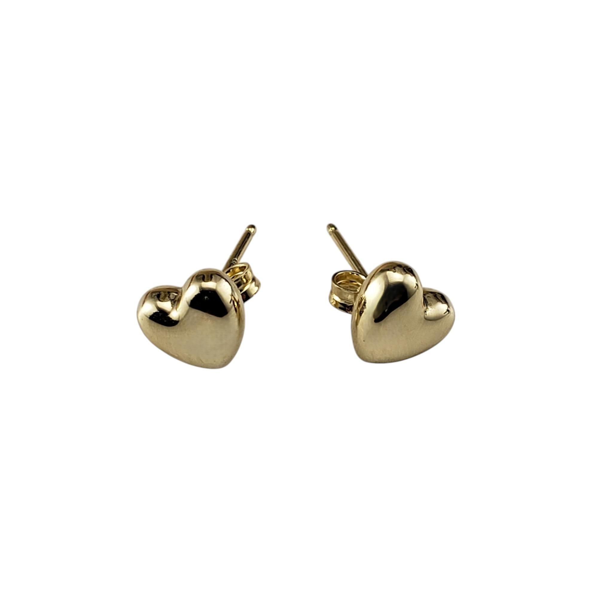 14 Karat Yellow Gold Heart Stud Earrings

These 14K yellow gold stud earrings each feature a small, polished heart shape that provides a subtle yet meaningful symbol of love and affection. Their minimalist design ensures that they can be easily