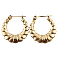 14 Karat Yellow Gold Puffy Hollow Ribbed Twist Hoop Earrings #18985