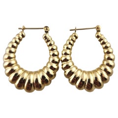 14 Karat Yellow Gold Puffy Oval Ribbed Hoop Earrings #18986