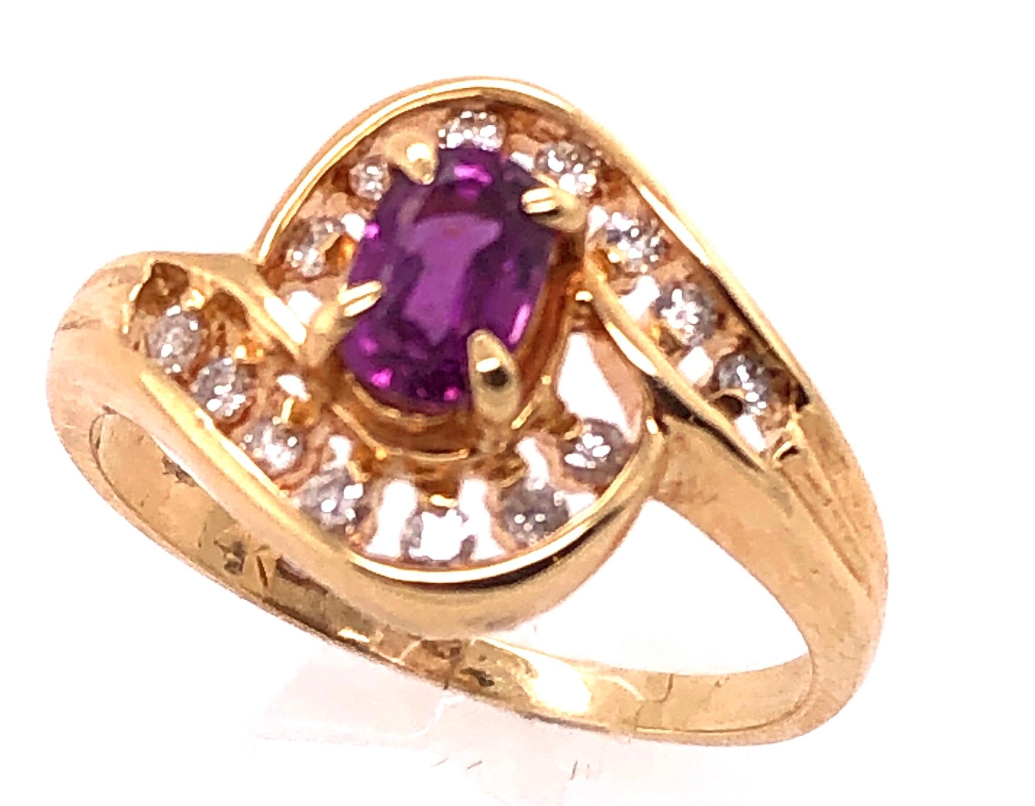 14 Karat Yellow Gold Purple Peridot Ring with Round Diamond Accents 
0.14 TDW.
Size 7.5
3.48 grams total weight.