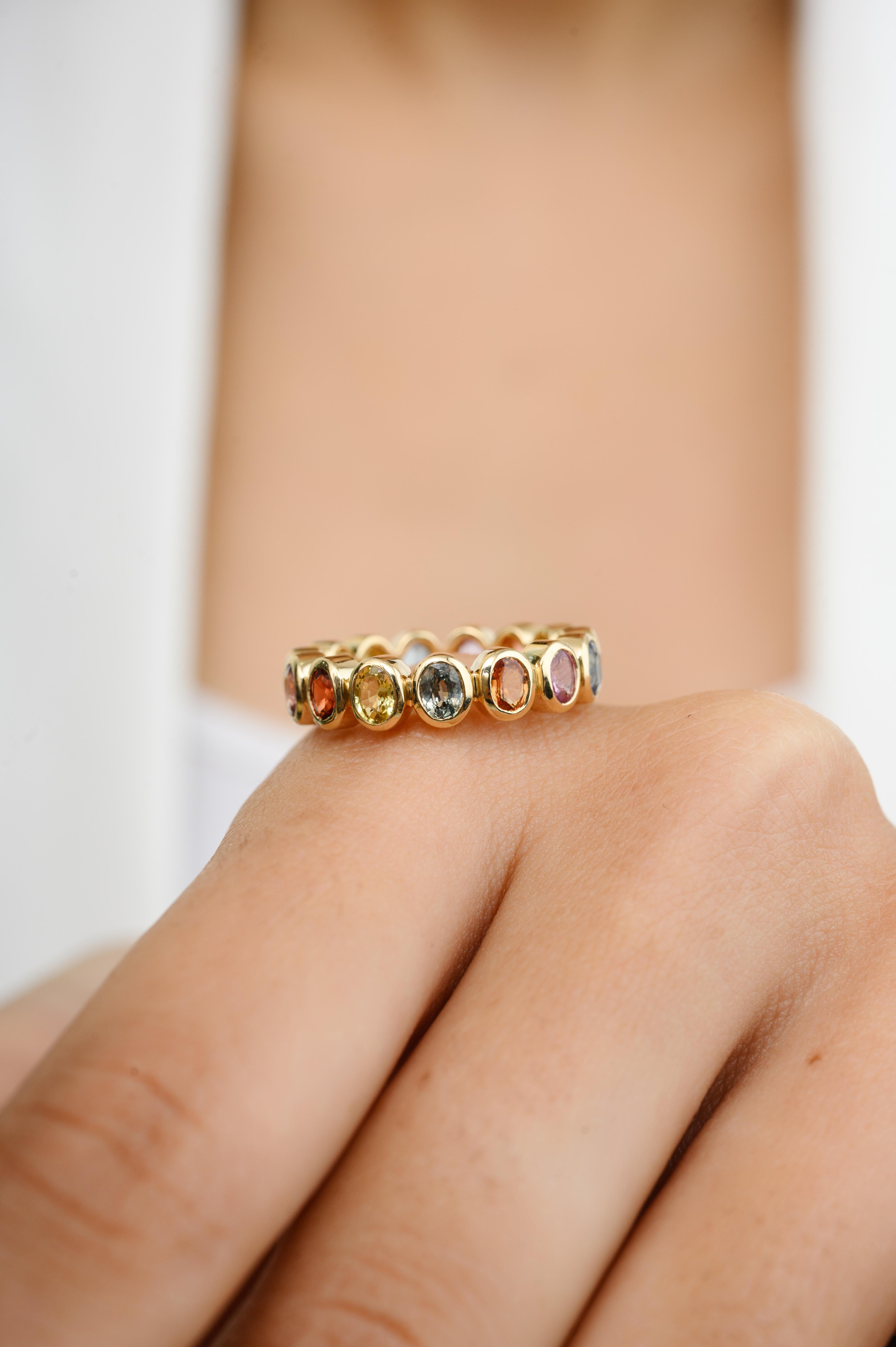 For Sale:  14 Karat Yellow Gold Rainbow Sapphire Bezel Set Eternity Band Ring for Her 6