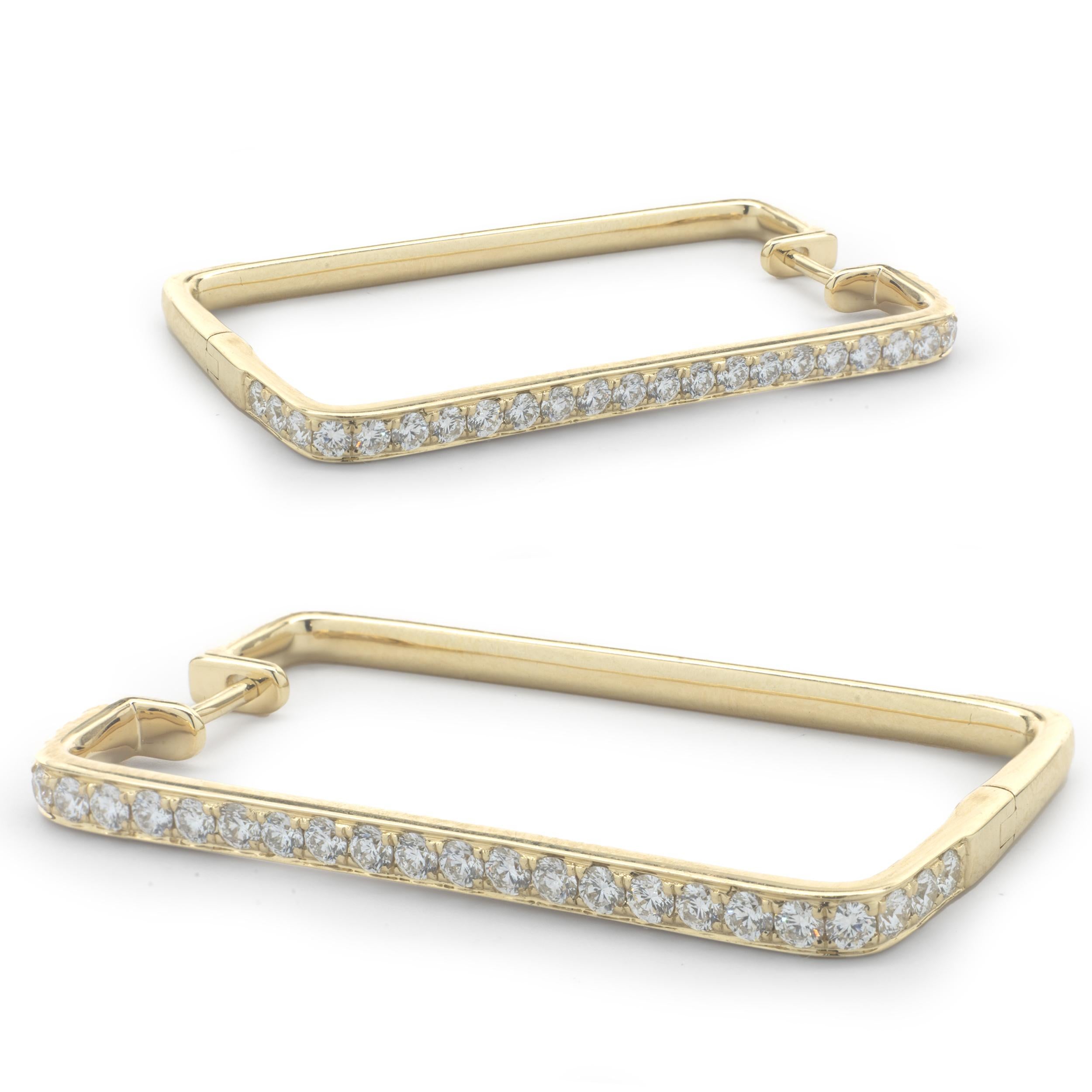 Designer: custom
Material: 14K yellow gold
Diamond: 50 round brilliant diamonds= 1.26cttw
Color: G
Clarity: VS
Dimensions: earrings measure 36mm round
Fastenings: post with snap backs
Weight: 9.96 grams
