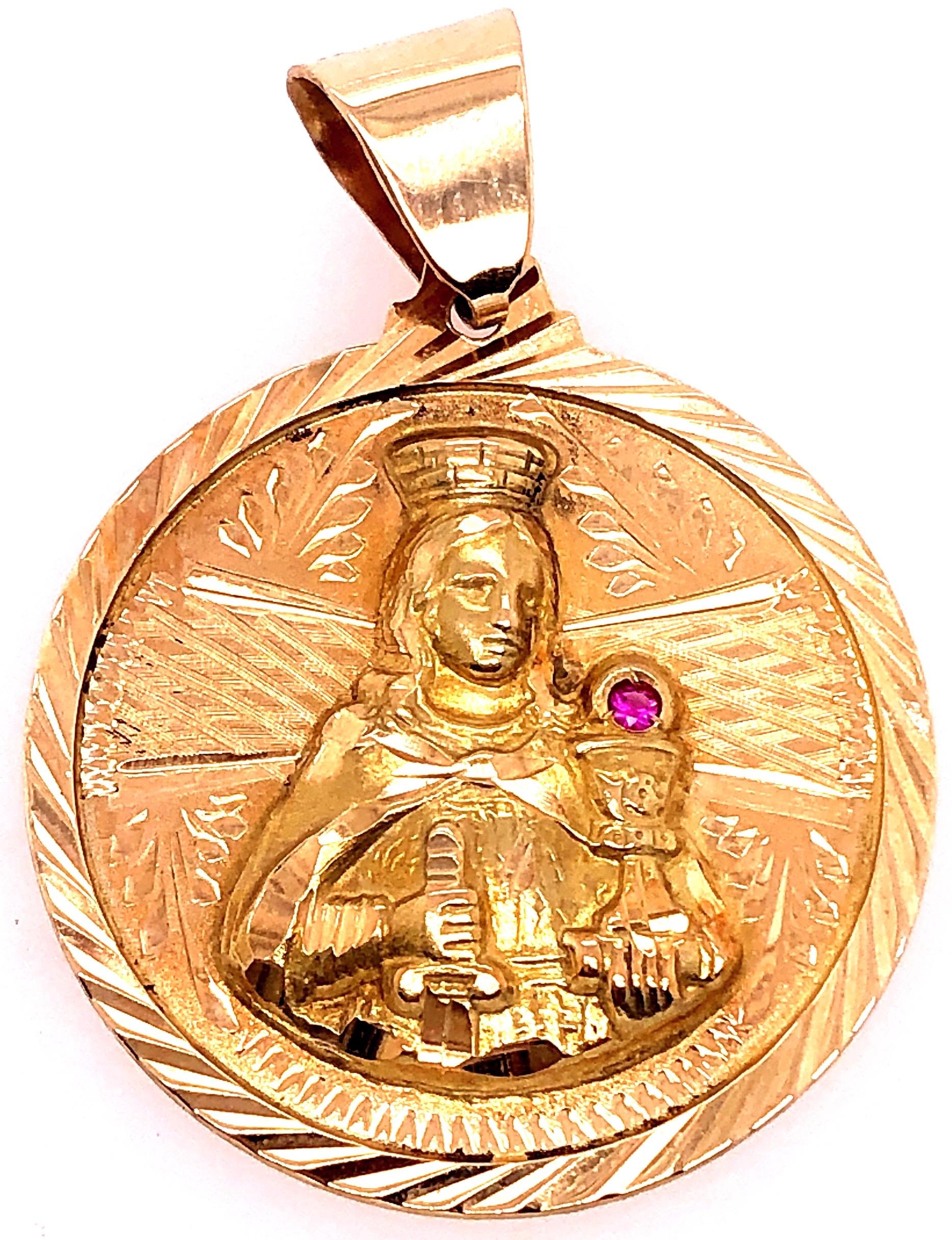 14 Karat Yellow Gold Religious Charm / Pendant with Ruby Accent
3.5 grams total weight
35.21 diameter
