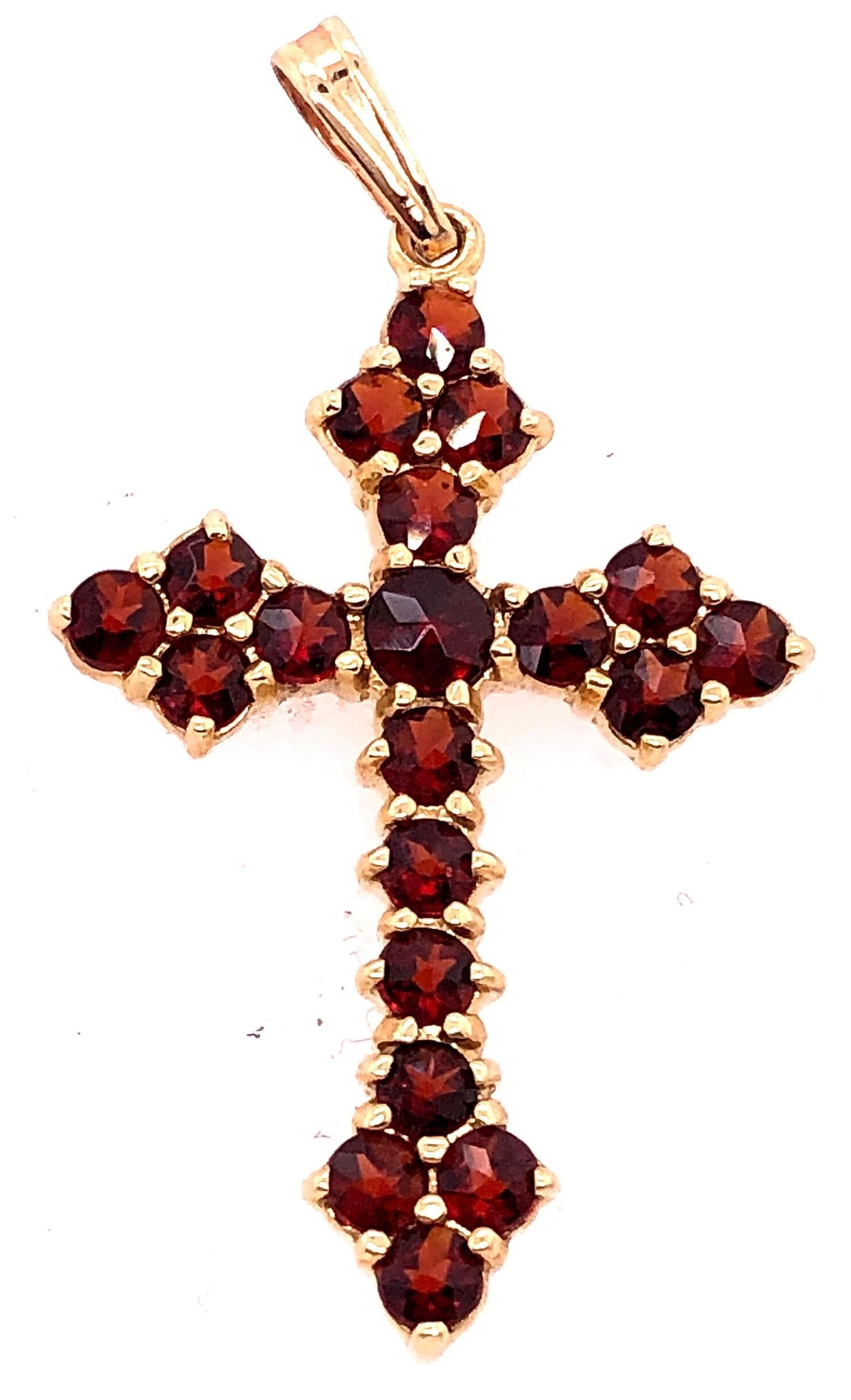 Pendentif religieux / Crucifix en or jaune 14 carats avec pierres semi-précieuses.
Poids total : 3 grammes.