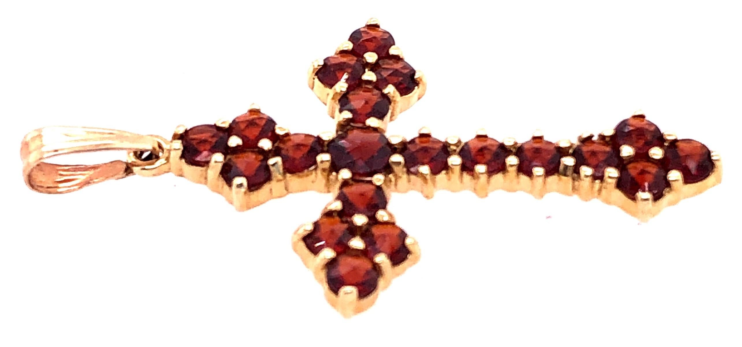 gold cross with stones