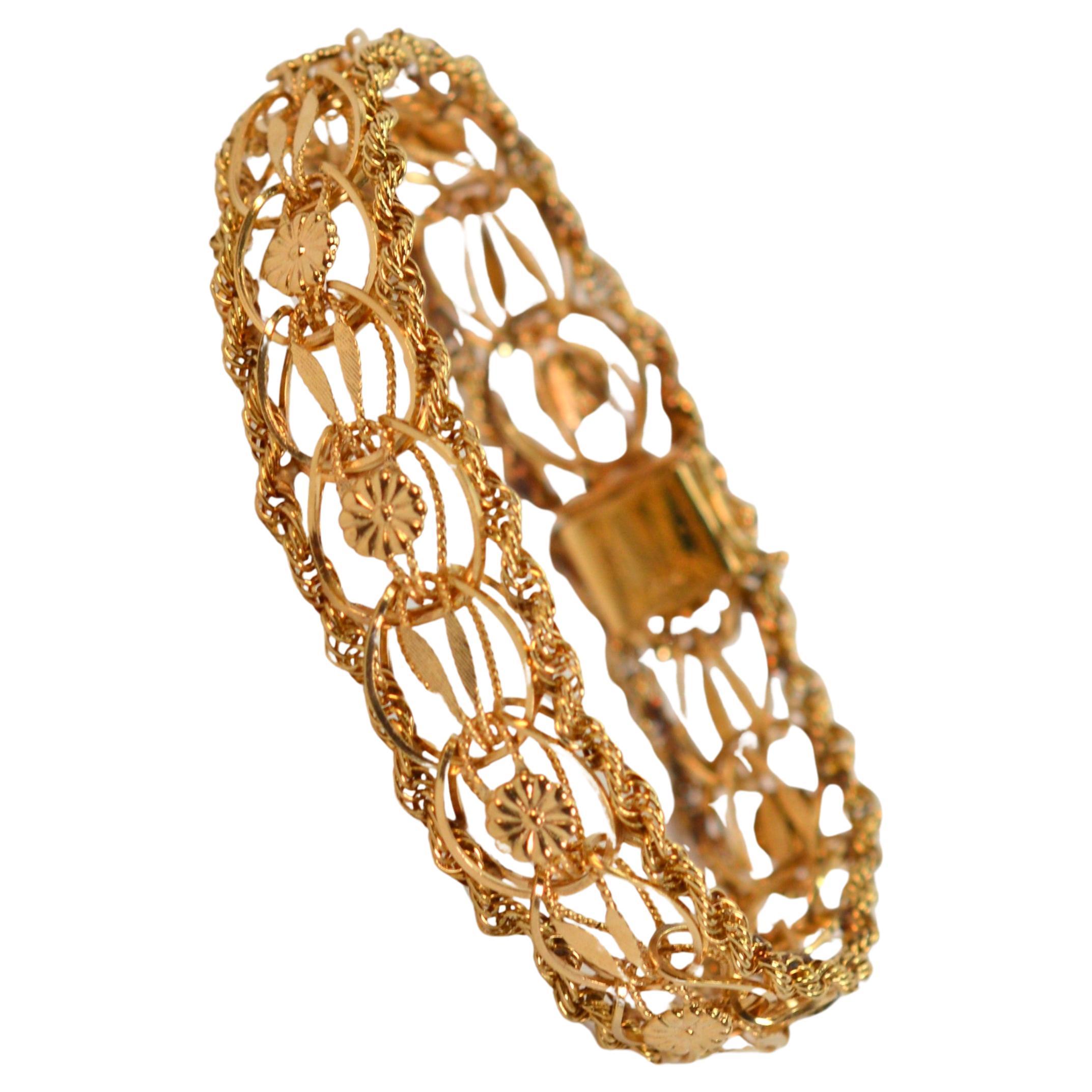 14 Karat Yellow Gold Ribbon Rope Bracelet w Floral Stations