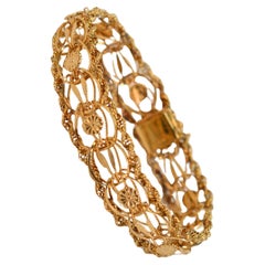 14 Karat Yellow Gold Ribbon Rope Bracelet w Floral Stations