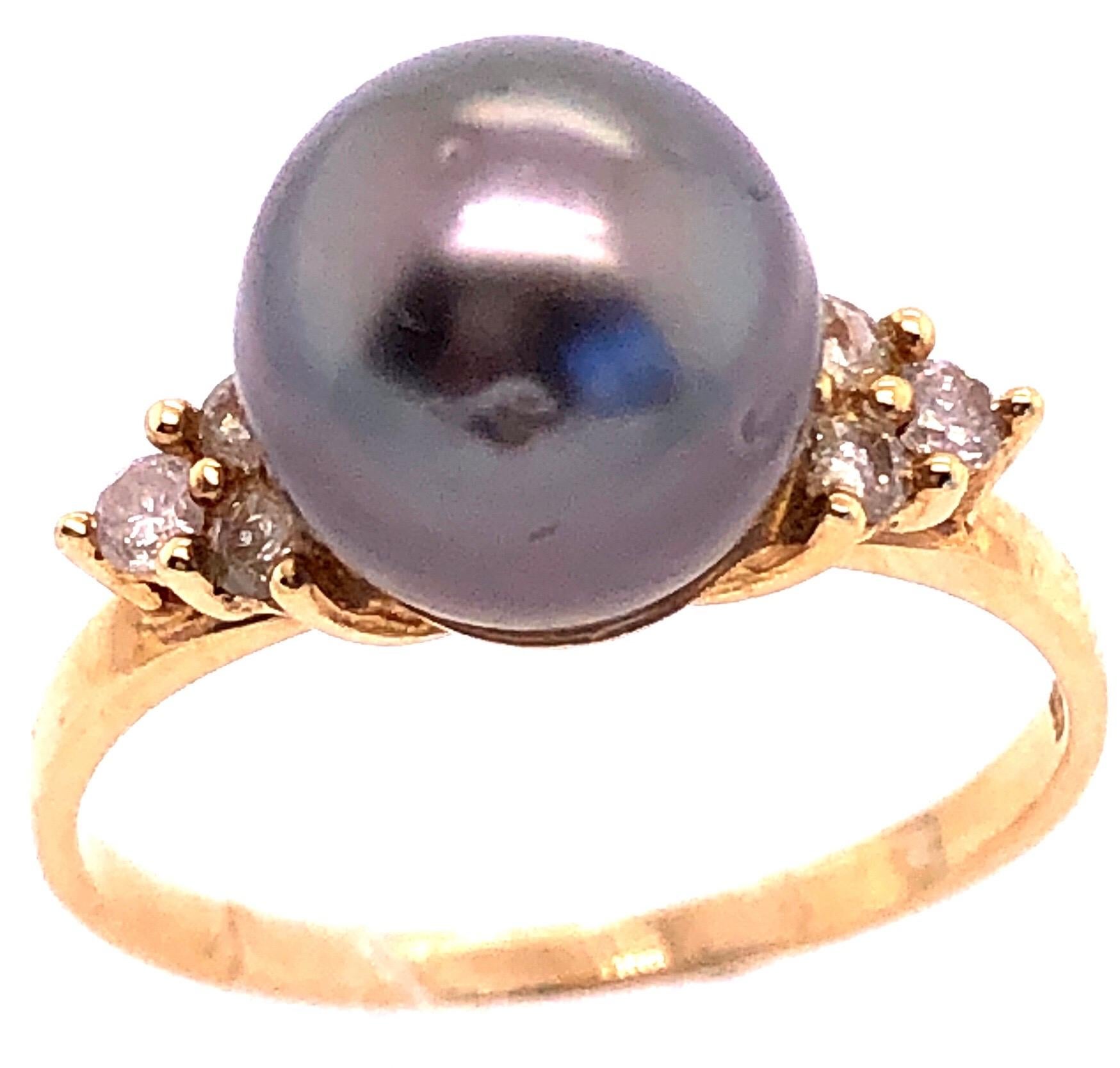 gold ring with black pearl