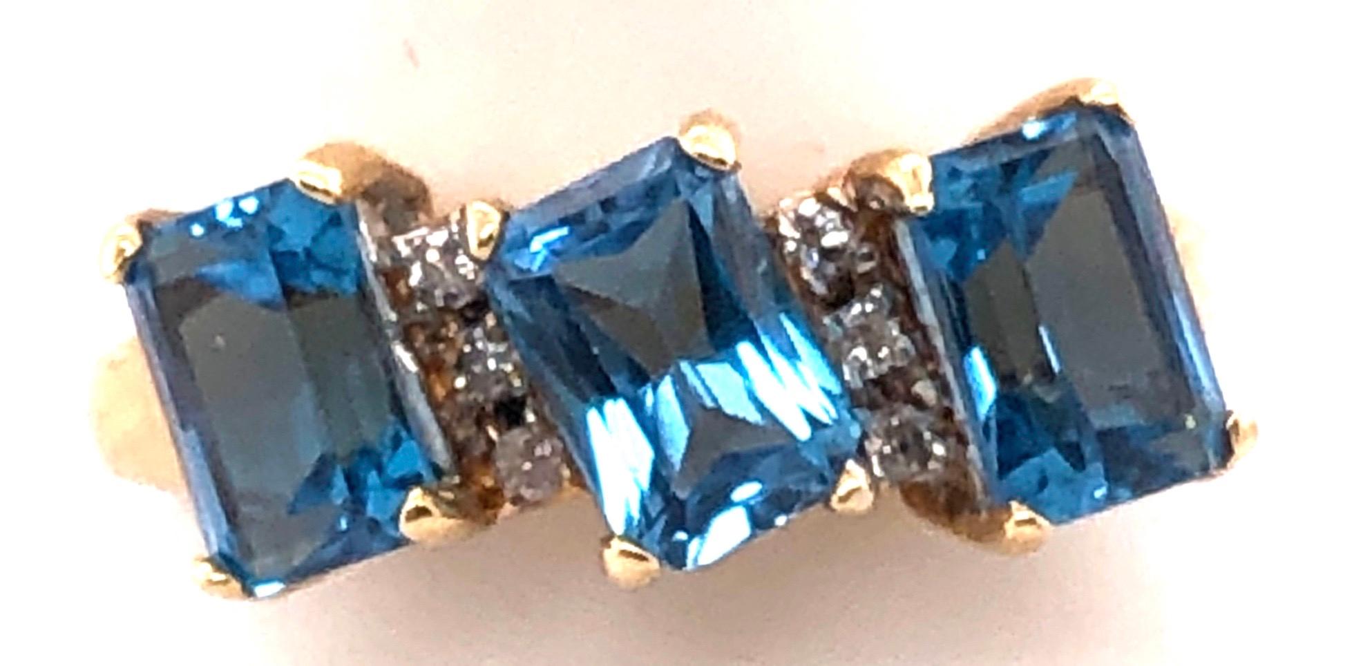 Women's or Men's 14 Karat Yellow Gold Ring Princess Cut Three Blue Topaz with Diamond Accents For Sale