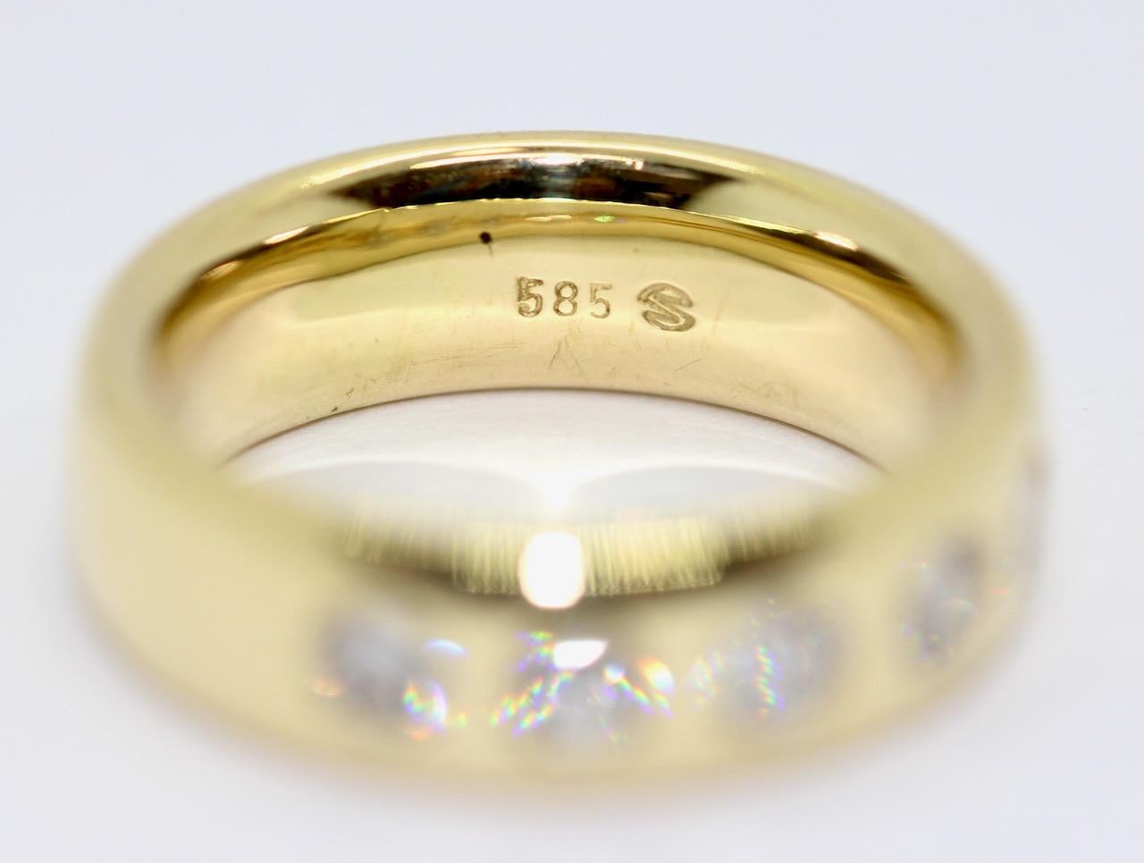 Round Cut 14 Karat Yellow Gold Ring Set with Five Solitaire Diamonds For Sale