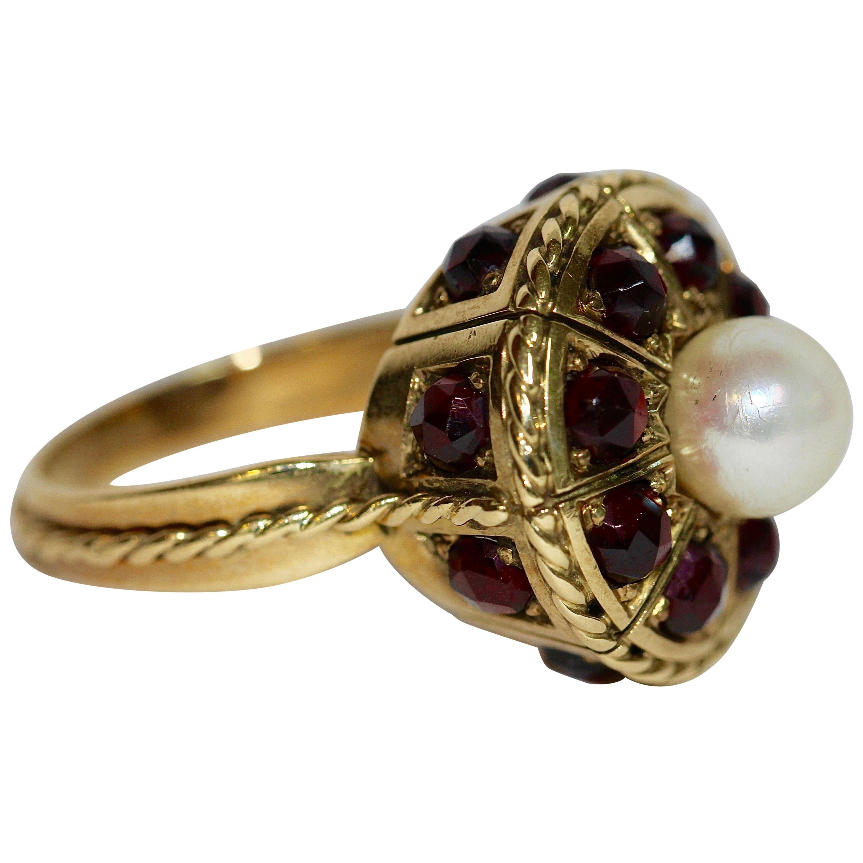 14 Karat Yellow Gold Ring Set with Many Garnets and a Large Pearl For Sale