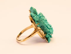 14 Karat Yellow Gold Ring Set with Turquoise Carved in Floral Decor