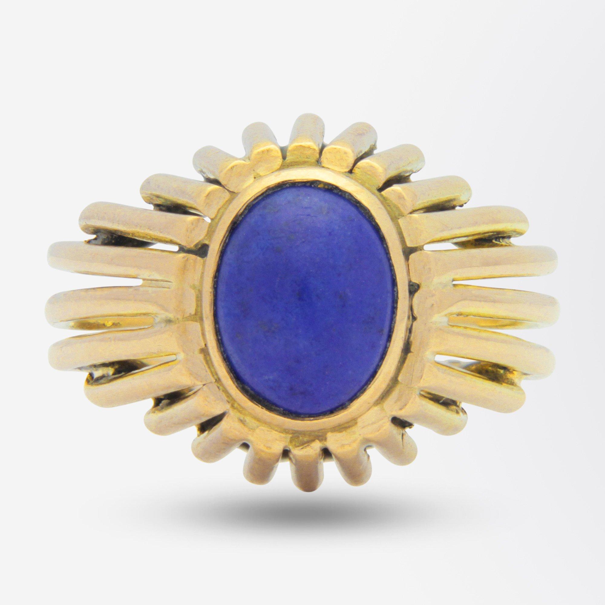 A beautifully crafted yellow gold ring set with a cabochon piece of lapis lazuli. The ring is created with thin strands of 14 karat yellow gold which have been fused together to create a shank and 'bombe' type setting which houses the cabochon lapis