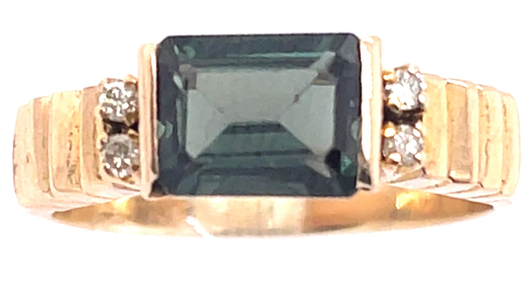 14 Karat Yellow Gold Ring With Center Emerald Cut Peridot And Diamonds.
Size 7
4 round diamonds 0.08 total diamond weight.
8.00 x 6.00 mm U TO.
5 grams total weight.