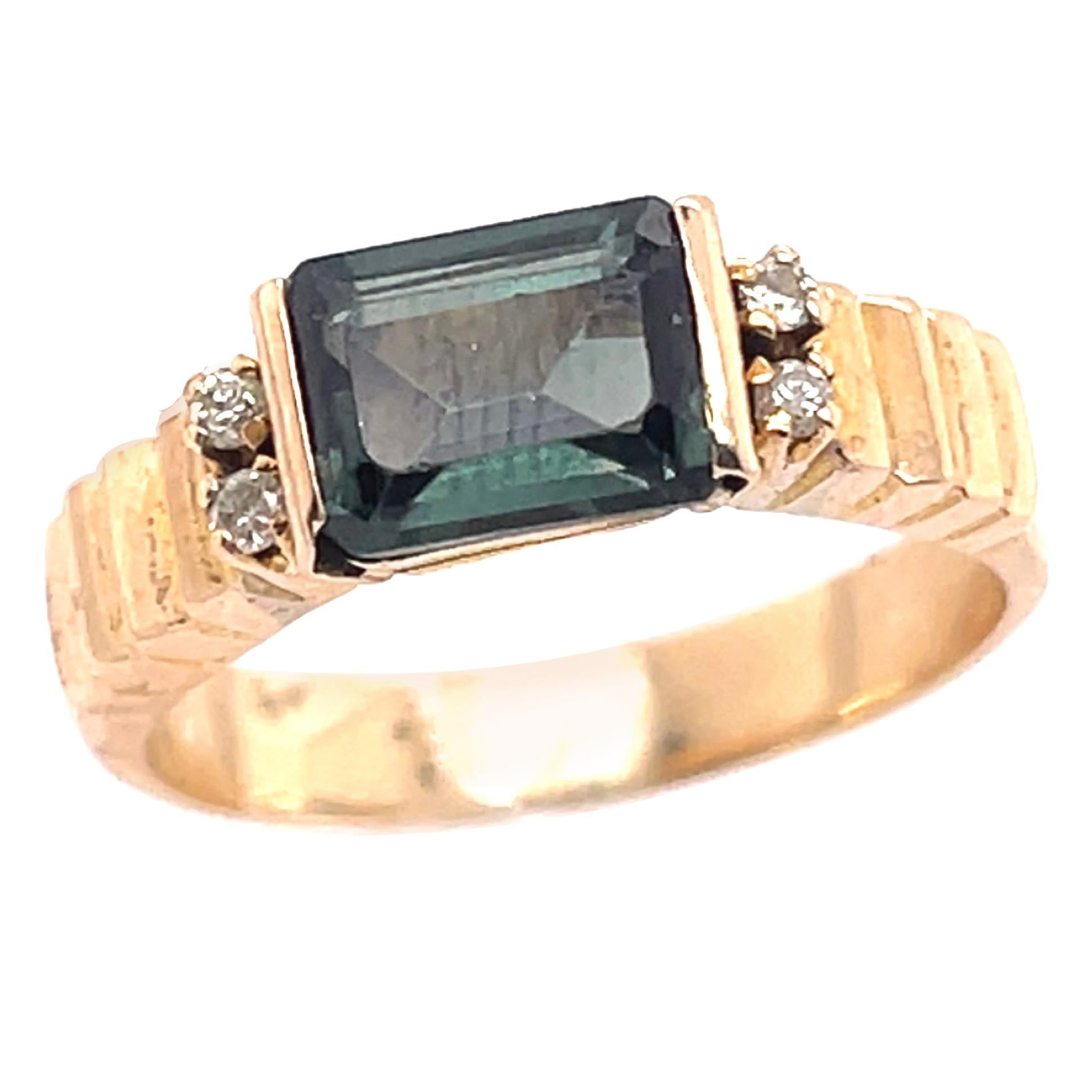 14 Karat Yellow Gold Ring with Center Emerald Cut Peridot and Diamonds