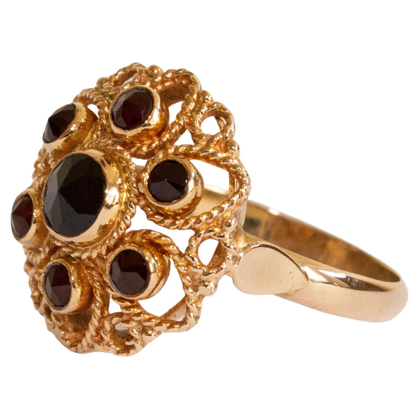 14 Karat Yellow Gold Ring with Garnets in Filigree Flower Setting For Sale