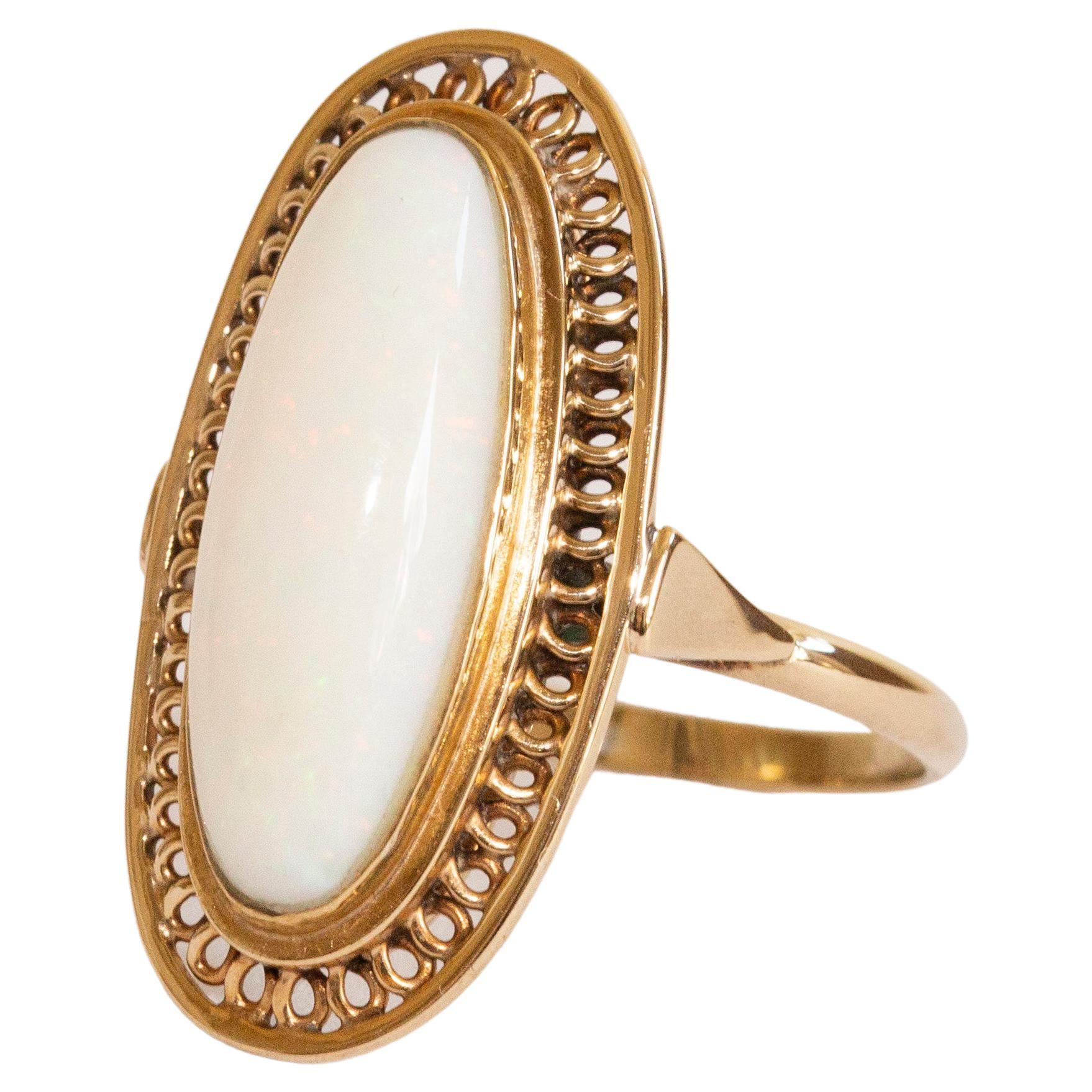 14 Karat Yellow Gold Ring with Oval Cut Elongated Natural White Opal For Sale
