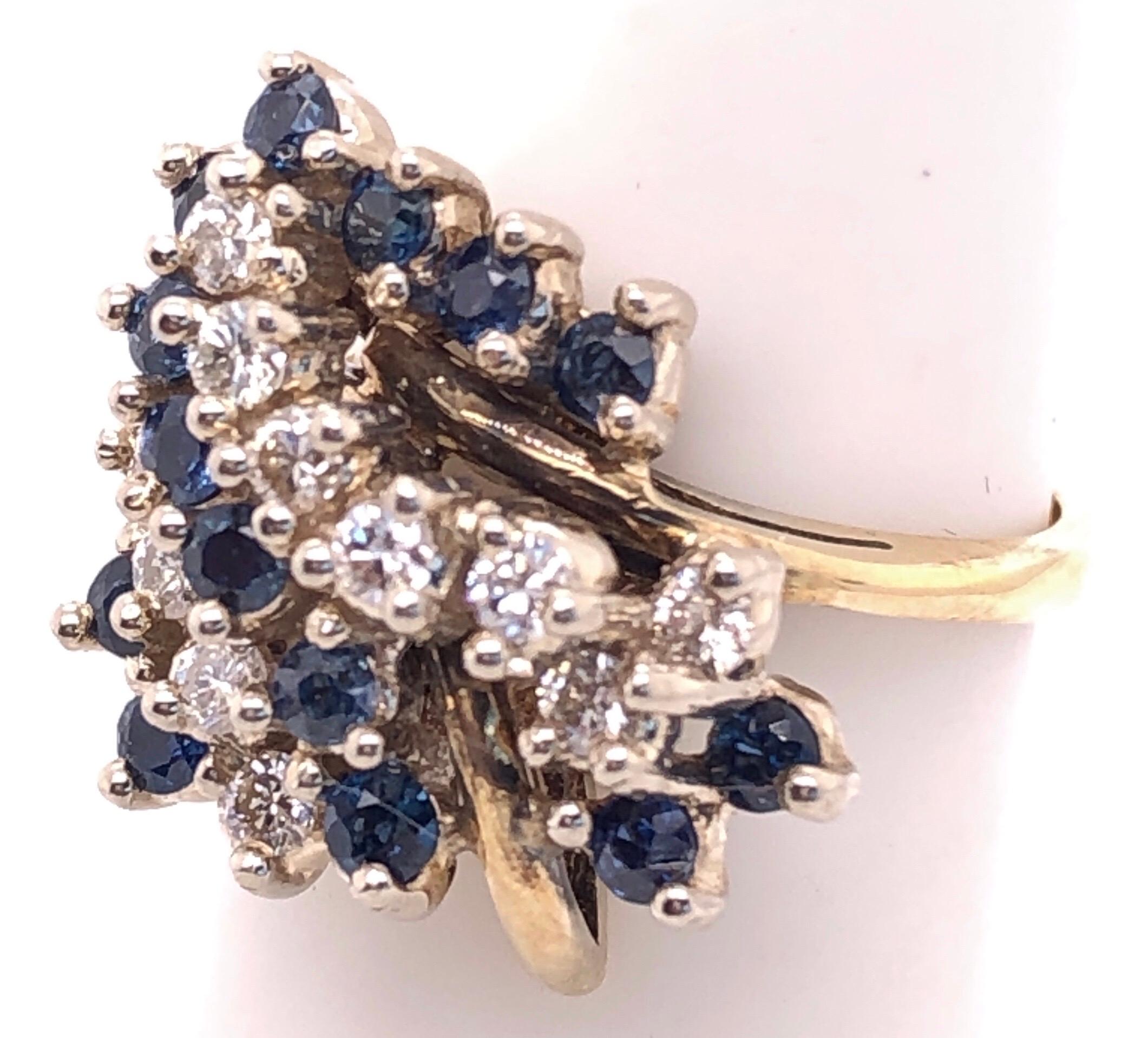 Modern 14 Karat Yellow Gold Ring with Sapphire and Diamond Cluster For Sale