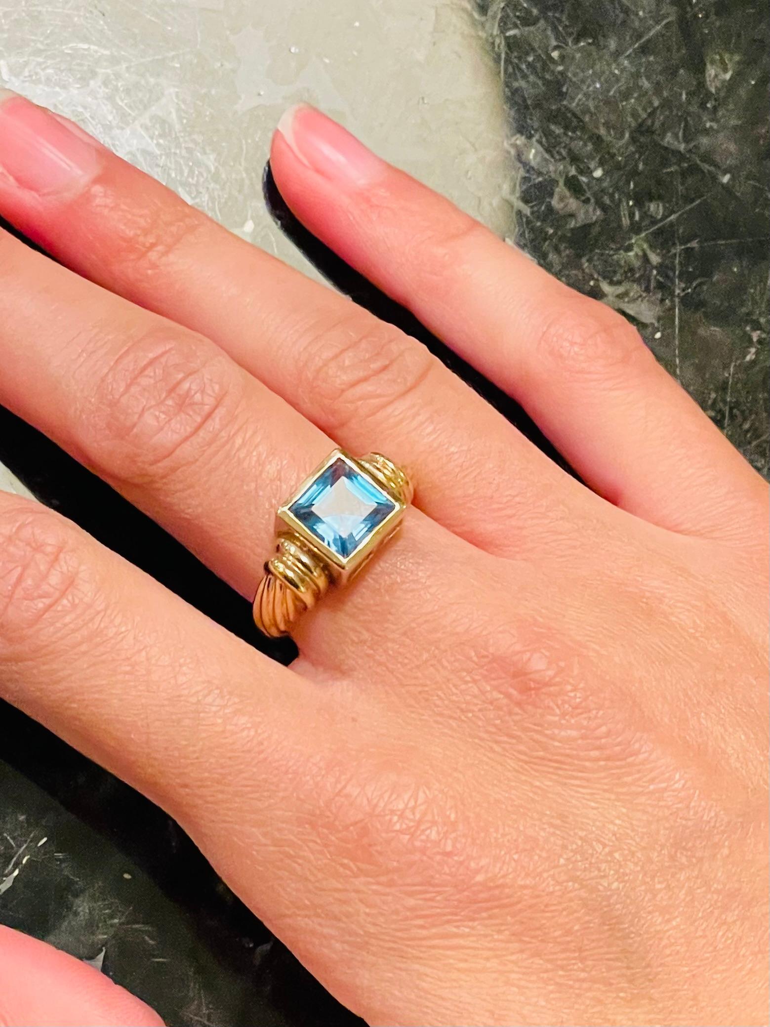 14 Karat Yellow Gold Ring with Solitaire Center Aquamarine Emerald Cut For Sale 4