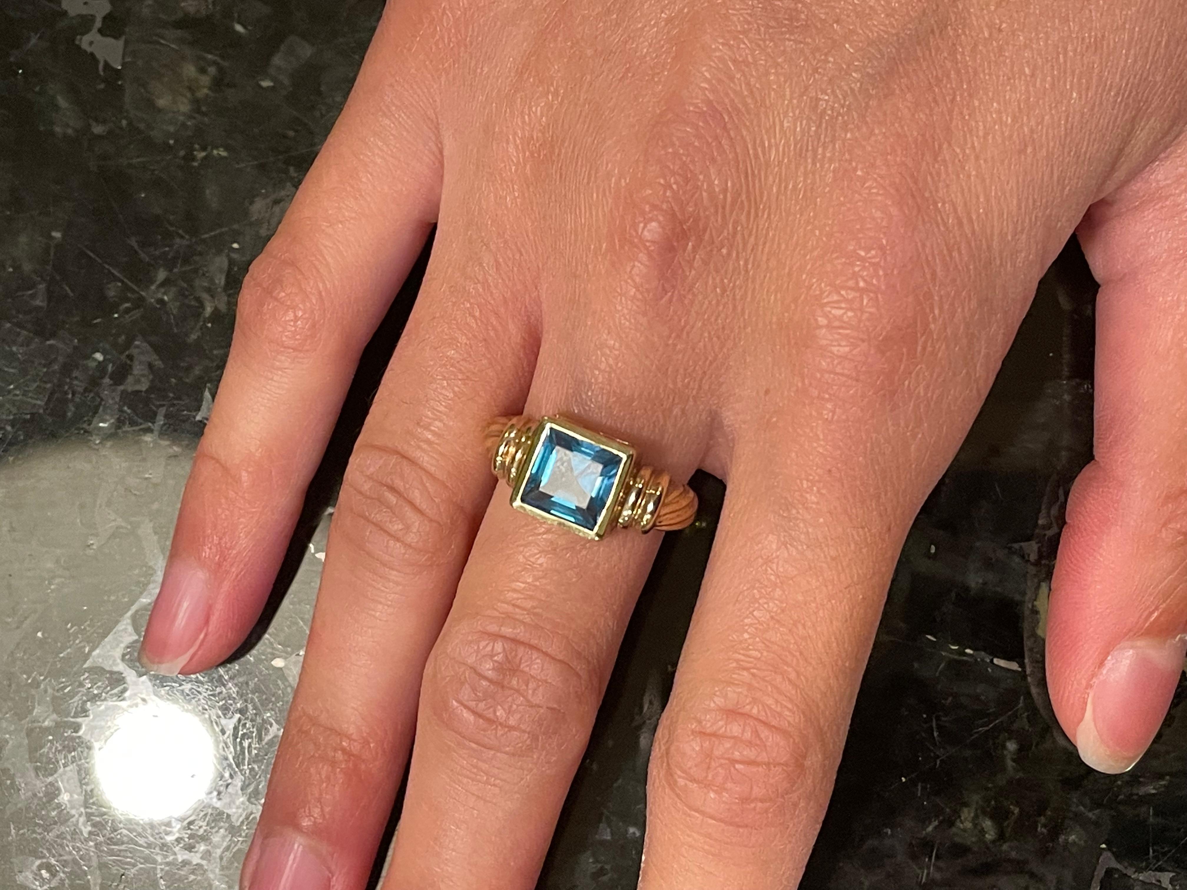 14 Karat Yellow Gold Ring with Solitaire Center Aquamarine Emerald Cut For Sale 6