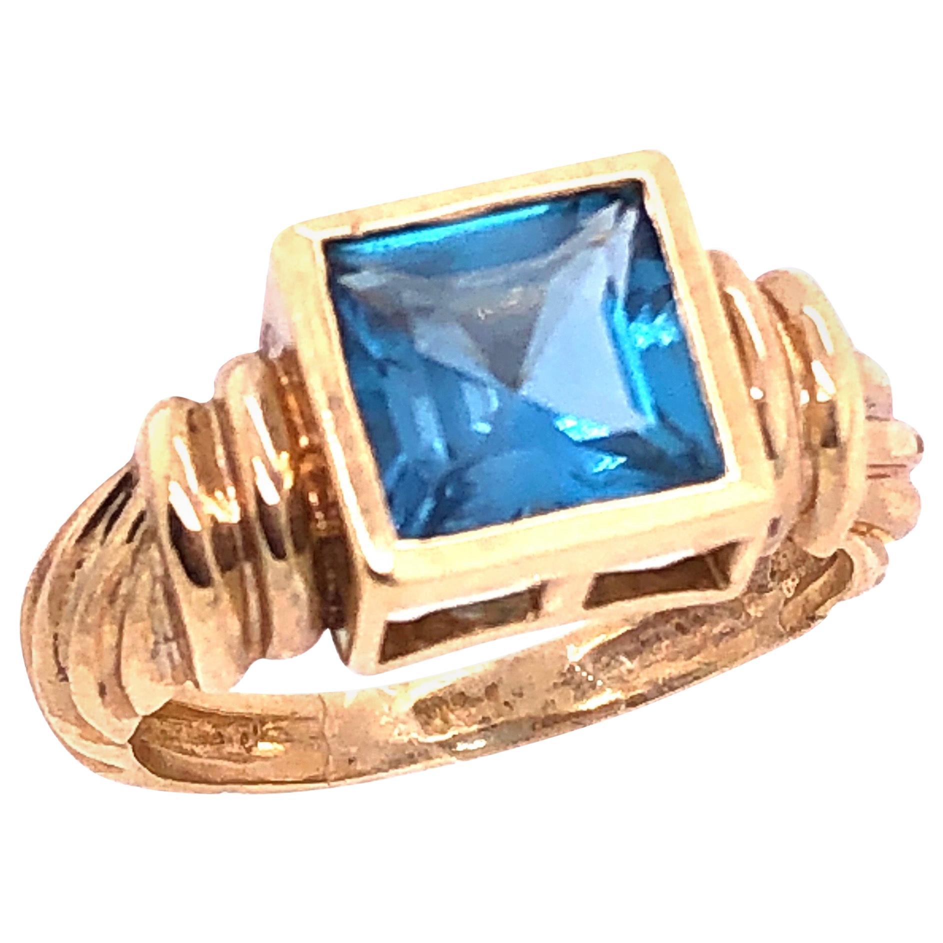14 Karat Yellow Gold Ring with Solitaire Center Aquamarine Emerald Cut For Sale