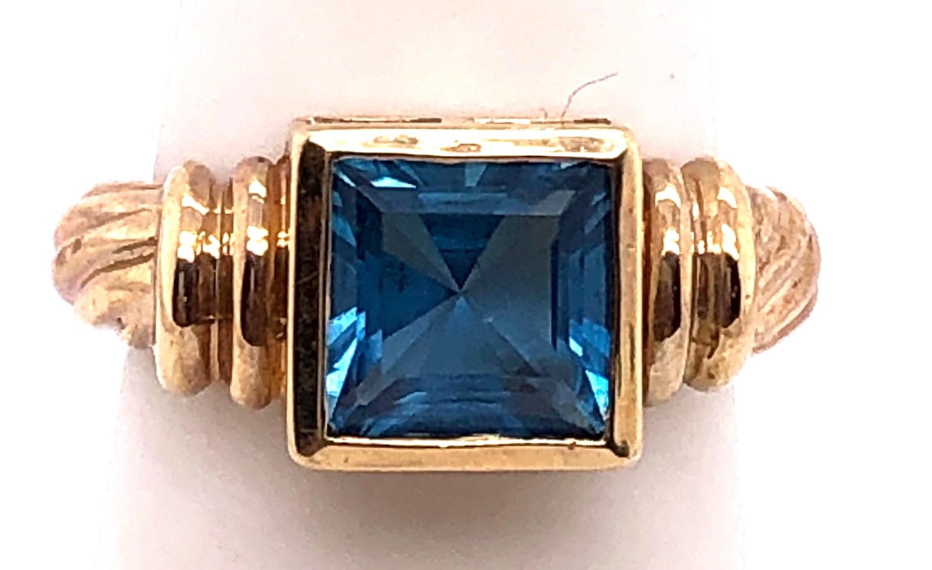 Women's or Men's 14 Karat Yellow Gold Ring with Solitaire Center Aquamarine Emerald Cut For Sale