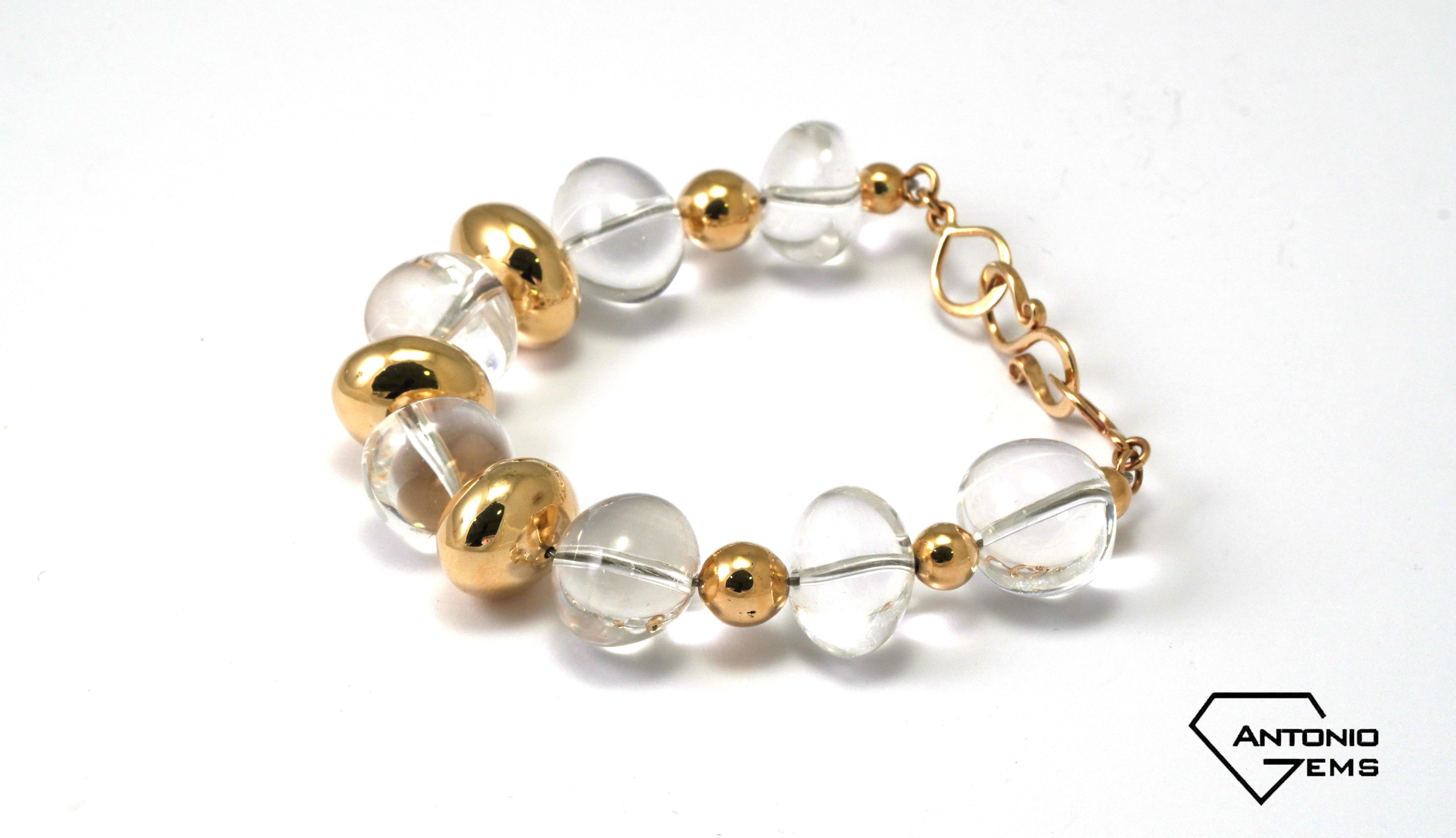 14 kt. Yellow Gold Bracelet with Rock Crystal
The bracelet is handmade.
Gold color: Yellow
Dimensions: 19 cm (Length). 
Total weight: 40,60 grams 
The Golden parts are hollow.

Set with:
- Rock Crystal
Cut: Cabochon