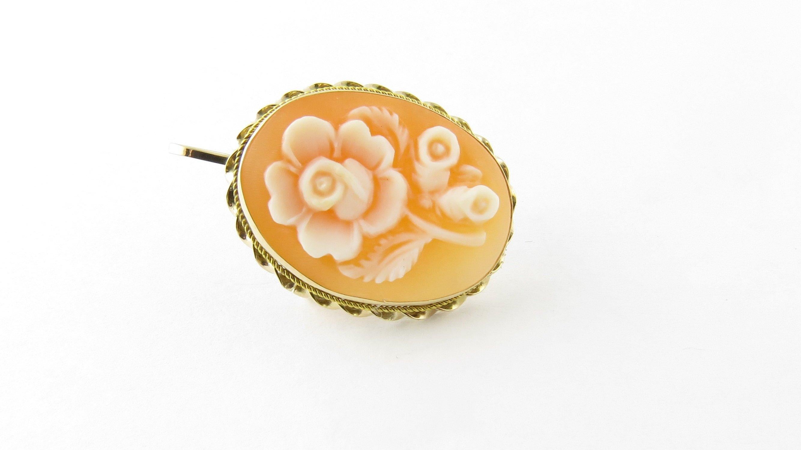 Vintage 14 Karat Yellow Gold Rose Cameo Brooch/Pendant
This lovely floral cameo brooch is set in meticulously detailed 14K yellow gold. Can be worn as a brooch or a pendant. 
Size: 23 mm x 18 mm 
Weight: 2.0 dwt. / 3.2 gr. 
Hallmark: 14K 
Very good