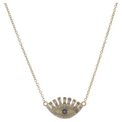 14 Karat Yellow Gold Round and Baguette Diamond and Sapphire Evil Eye Necklace