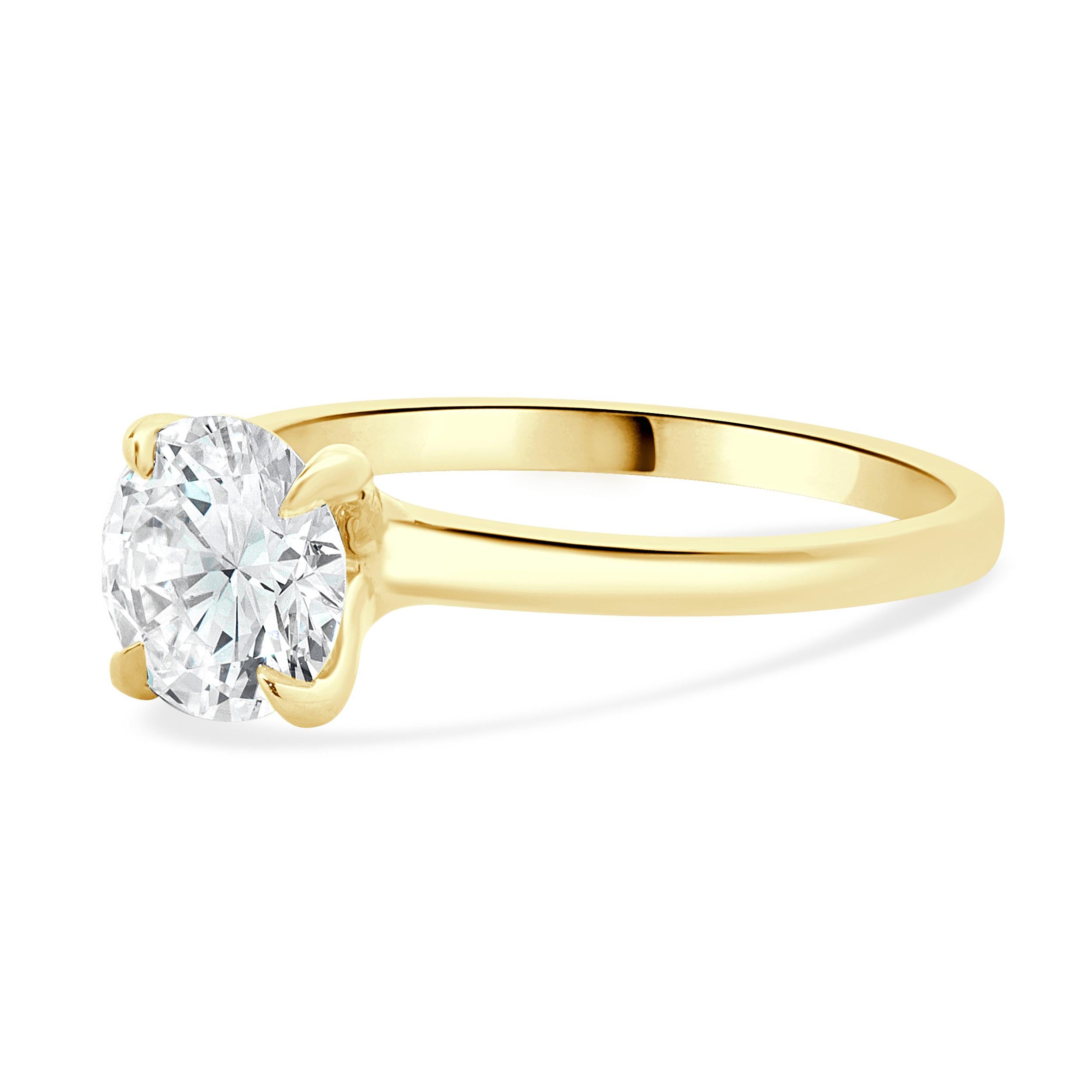 Designer: Custom
Material: 14K yellow gold
Diamond: 1 round brilliant cut = 1.06ct
Color: G
Clarity: VS1
GIA: 2235059617
Dimensions: ring top measures 1.8mm wide
Ring Size: 6.5 (complimentary sizing available)
Weight: 2.35 grams
