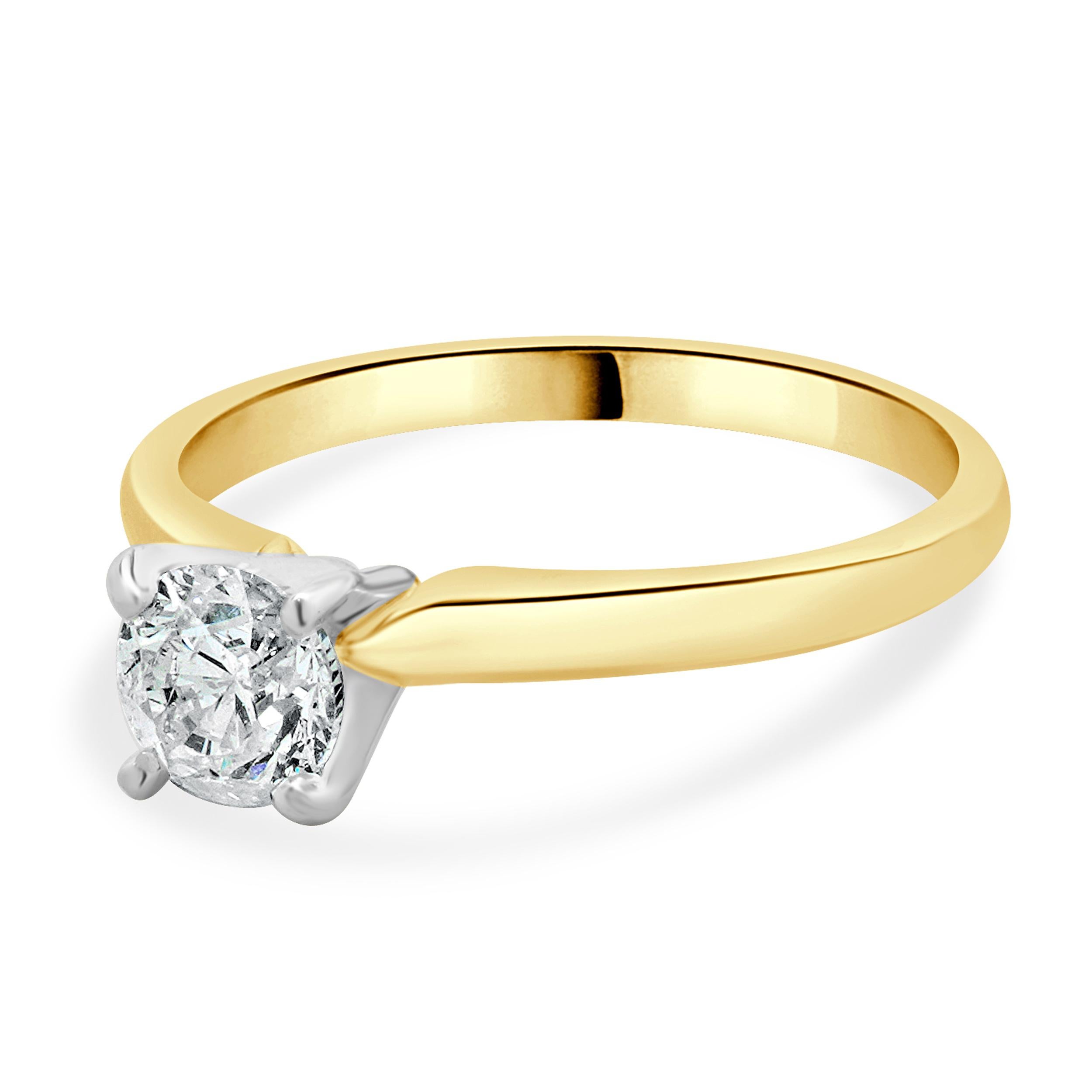 Designer: custom design
Material: 14K yellow gold
Center Diamond: 1 round brilliant cut = 0.71ct
Color : I
Clarity : I2
Dimensions: ring top measures 7mm
Size: 7 complimentary sizing available 
Weight: 2.40 grams
