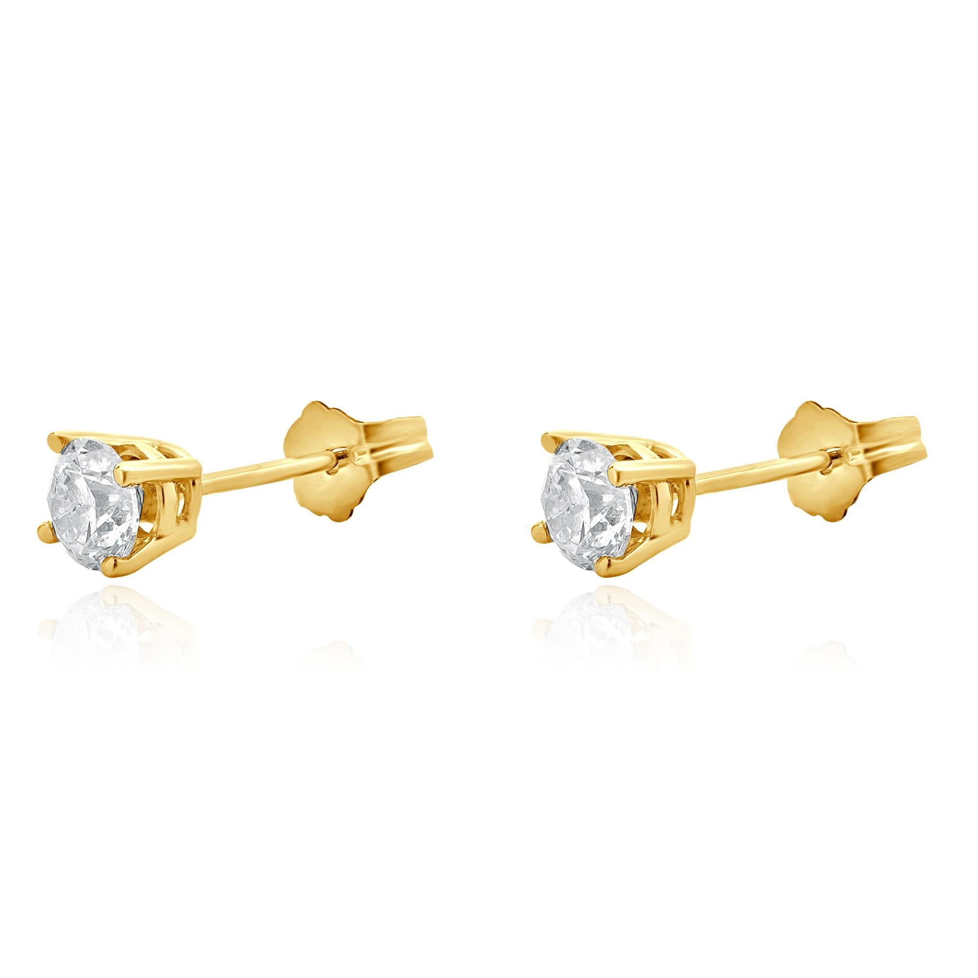 Matériau : Or jaune 14K
Diamants : 2 diamants ronds de taille brillant = 0,70cttw
Couleur : G 
Clarté : I2
Dimensions : les boucles d'oreilles mesurent environ 4.8 mm de diamètre.
Fermetures : dos à friction
Poids : 0,93 grammes