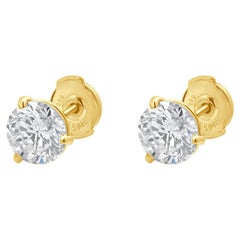 Clous d
oreilles en or jaune 14 carats avec diamants taille brillant rond