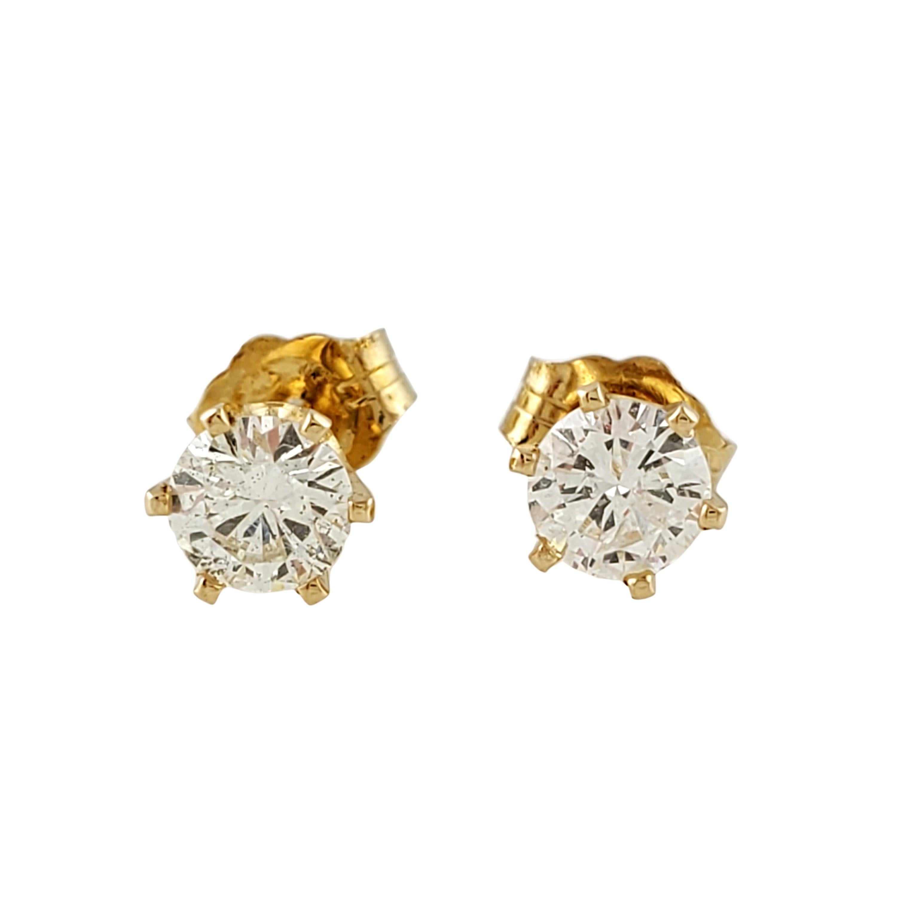 Vintage 14K Yellow Gold Round Brilliant Diamond Stud Earrings 

These earrings are set with round brilliant diamonds in a 6 prong setting. 

Diamonds total approx. .60 ct twt and are SI2, H 

4.3 mm from front to back 

Push backs stamped 14K 

.4