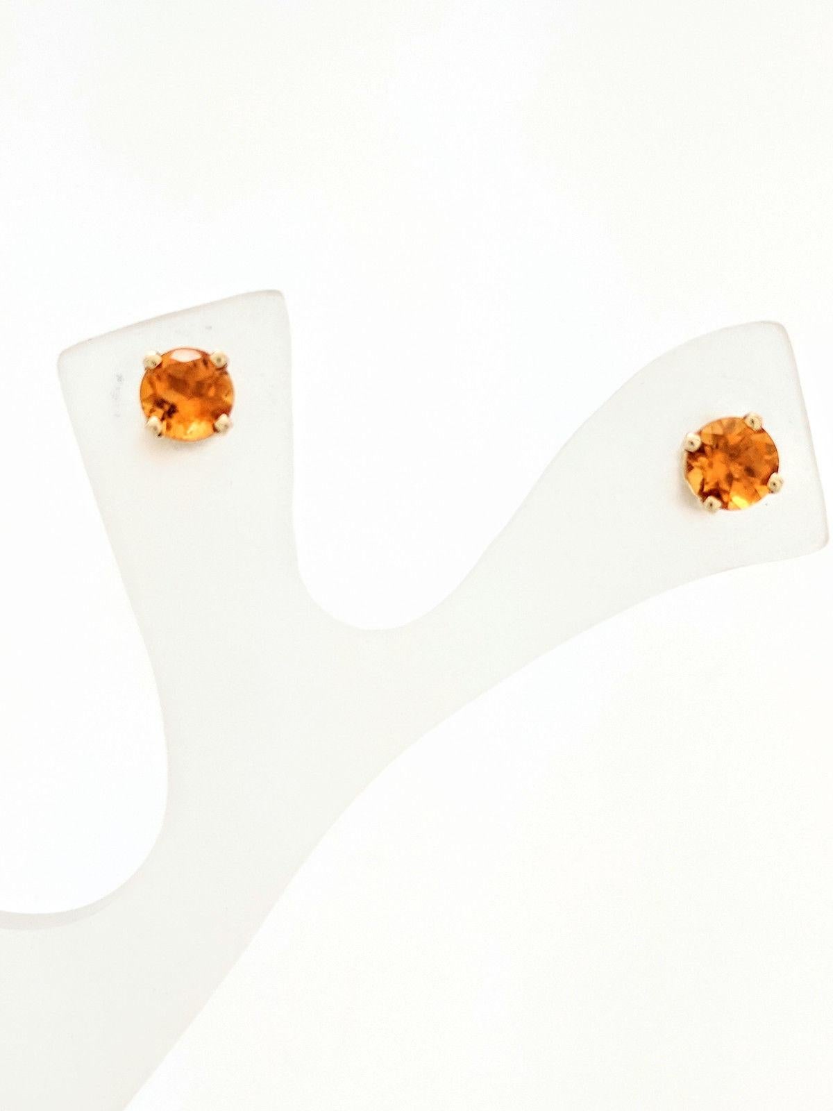 You are viewing a beautiful pair of citrine stud earrings. These earrings are crafted from 14k yellow gold and weighs 1 gram. Each earring features (1) 5mm round citrine gemstone set in a 4-prong basket setting with post backs. These earrings come