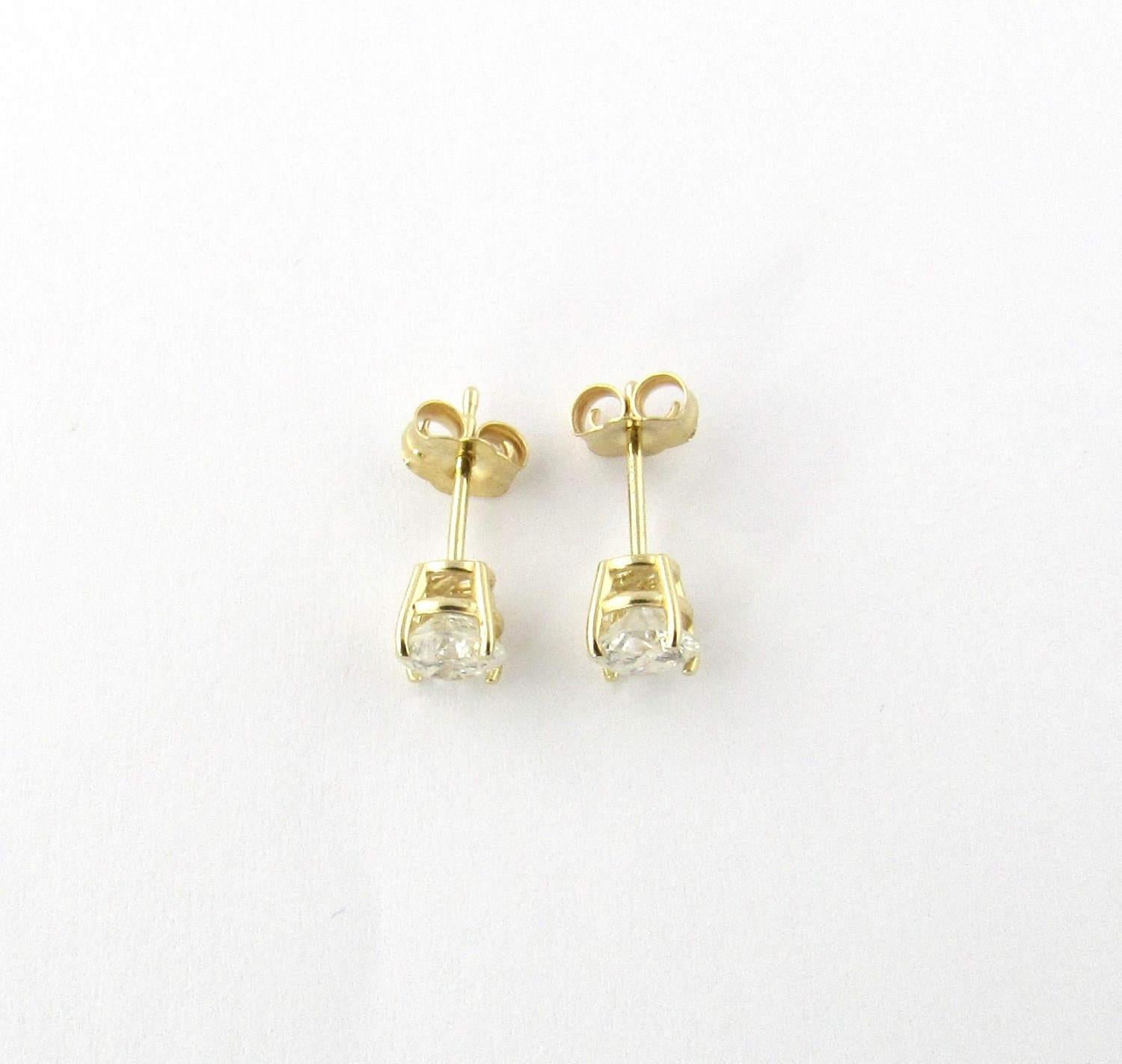 Vintage 14K Yellow gold diamond stud earrings. Round brilliant diamonds approx. .40ct each. 
Approx. twt .80ct. J-K color. I2 clarity.   Yellow wire base settings with push on backs. 14mm long. 6mm wide at prongs.Posts marked: 14K ZEI Backs marked: