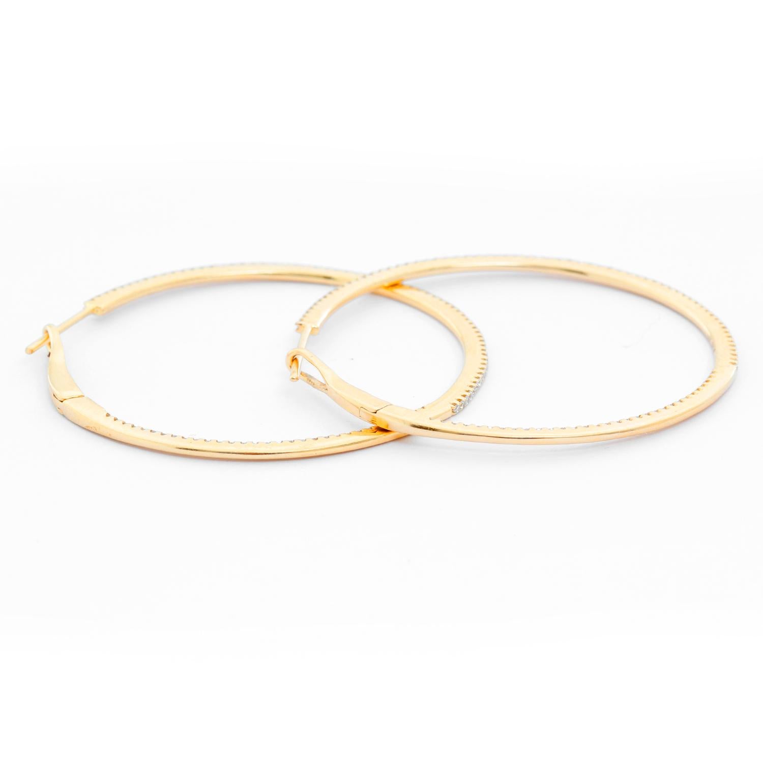 14K Yellow Gold Round Inside Out Hoops - Stunning and delicate 14K Yellow Gold hoops. Measuring 1 1/2  in. in diameter with .55 cts of diamonds. Clarity SI. Color GH. Total weight 4.6 grams. 