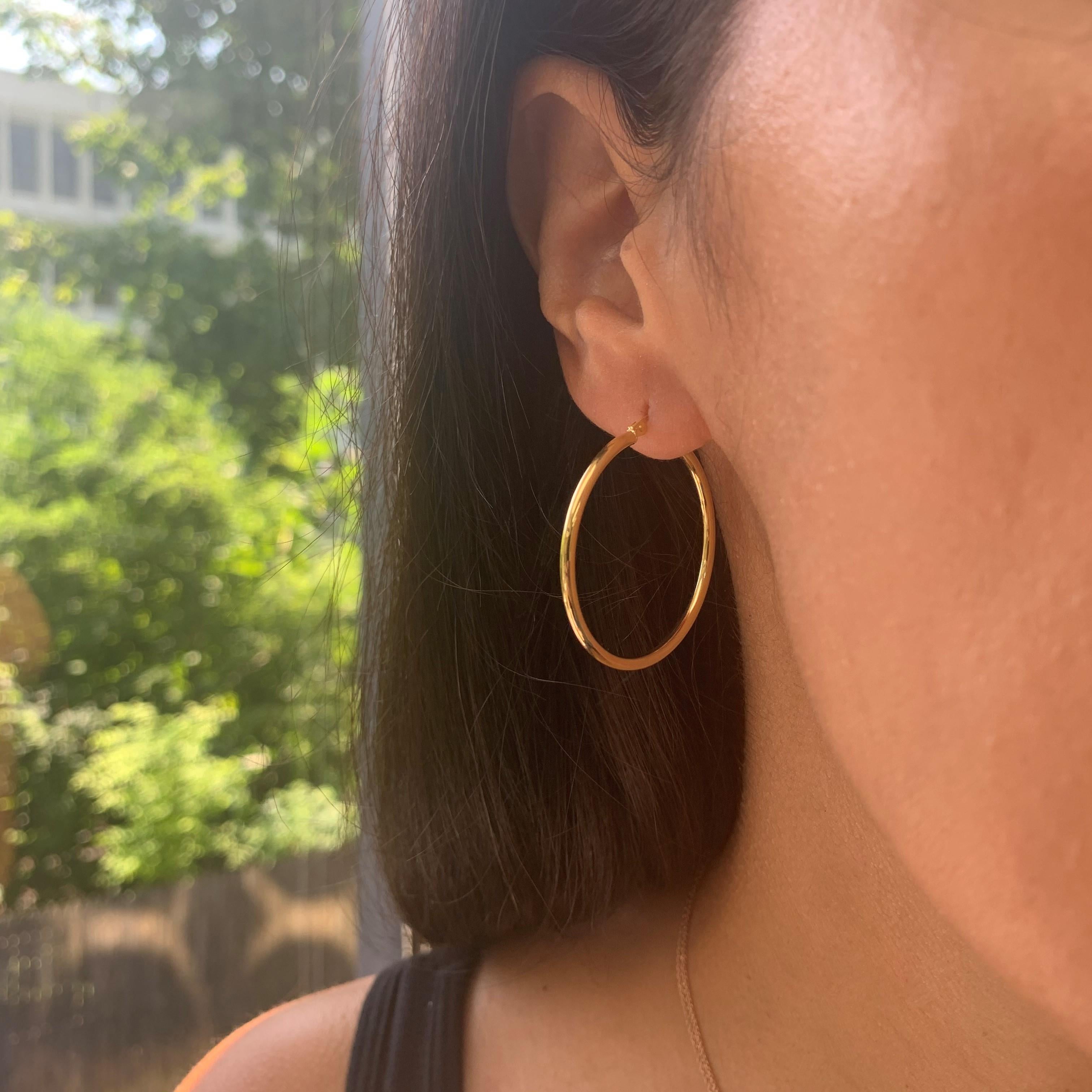 These Elegant and Stylish 14K Yellow Gold Hoop Earrings will add that perfect Glam to your look! Earring Measurements are 2 X 30 MM. 
Made in Italy. 
1.25