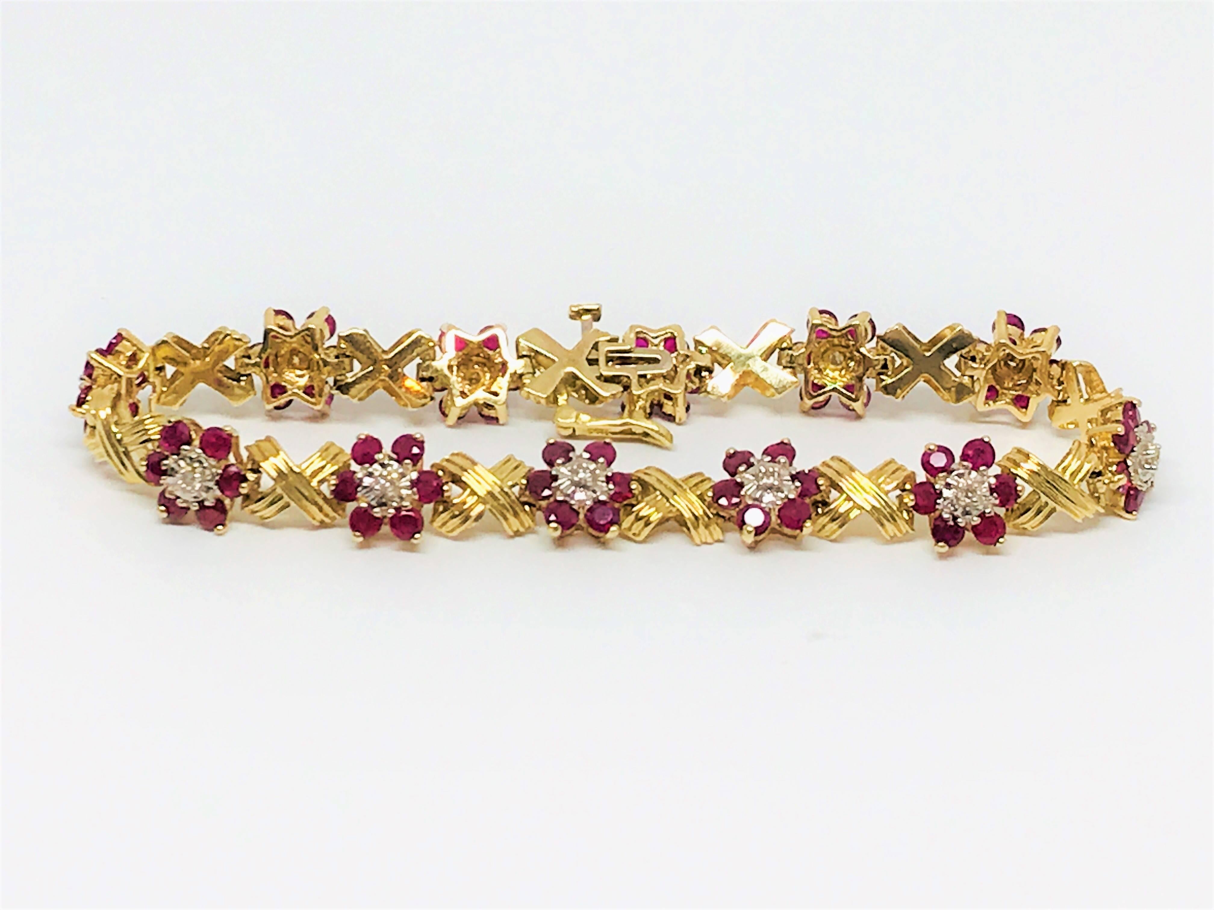 This is a stunningly bold ladies 14k yellow gold Ruby & Diamond Bracelet. There are 
10.0ct's of round cut Ruby & 0.20ct's of white round brilliant Diamonds.
Bracelet lenght is 7.25