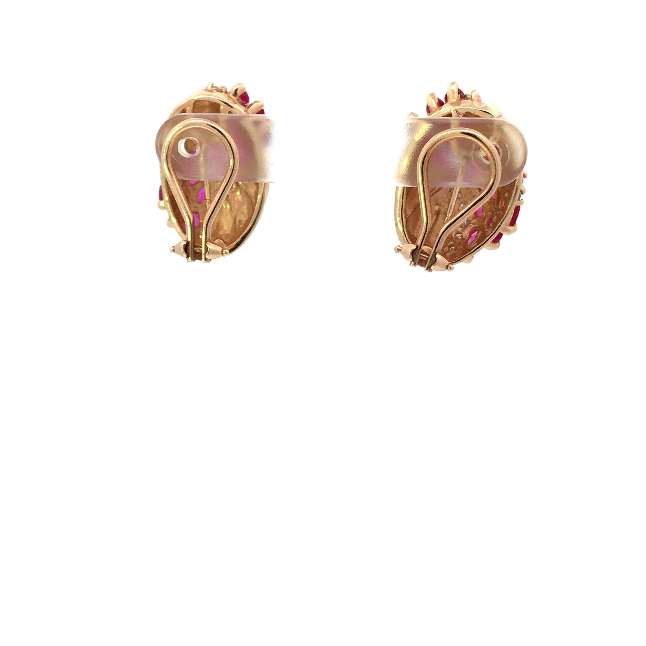 14KT YG Ruby  and Diamond Earrings - 1980s

Lady’s 14 carat yellow gold ruby earrings weighing 12.40 grams with 30 marquise cut rubies weighing 4.00. The earring is further enhanced with a total of 28 Round Brilliant Cut diamonds, well matched,