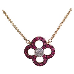 14 Karat Yellow Gold Ruby and Diamond Flower Pendant Hangs from Cable Chain