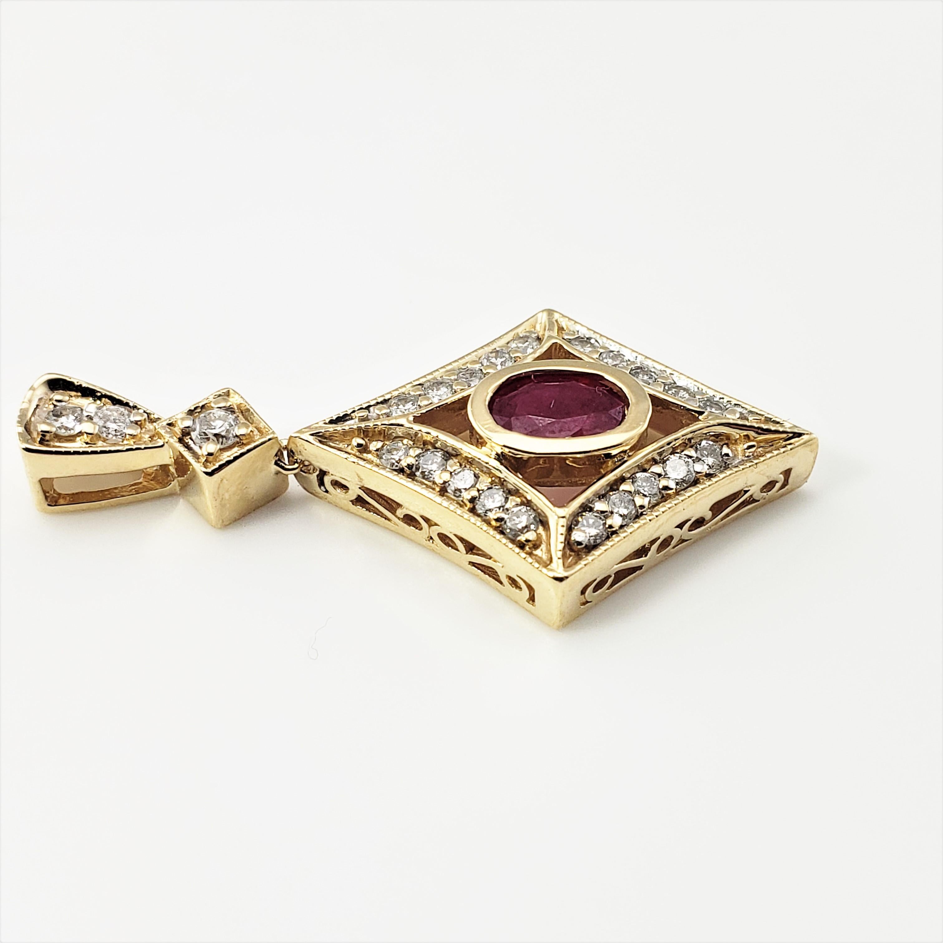 Vintage 14 Karat Yellow Gold Natural Ruby and Diamond Pendant-

This lovely pendant features one oval ruby (7 mm x 5 mm) and 20 round brilliant cut diamonds set in classic 14K yellow gold.

Approximate total diamond weight:  .47 ct.

Diamond color: 