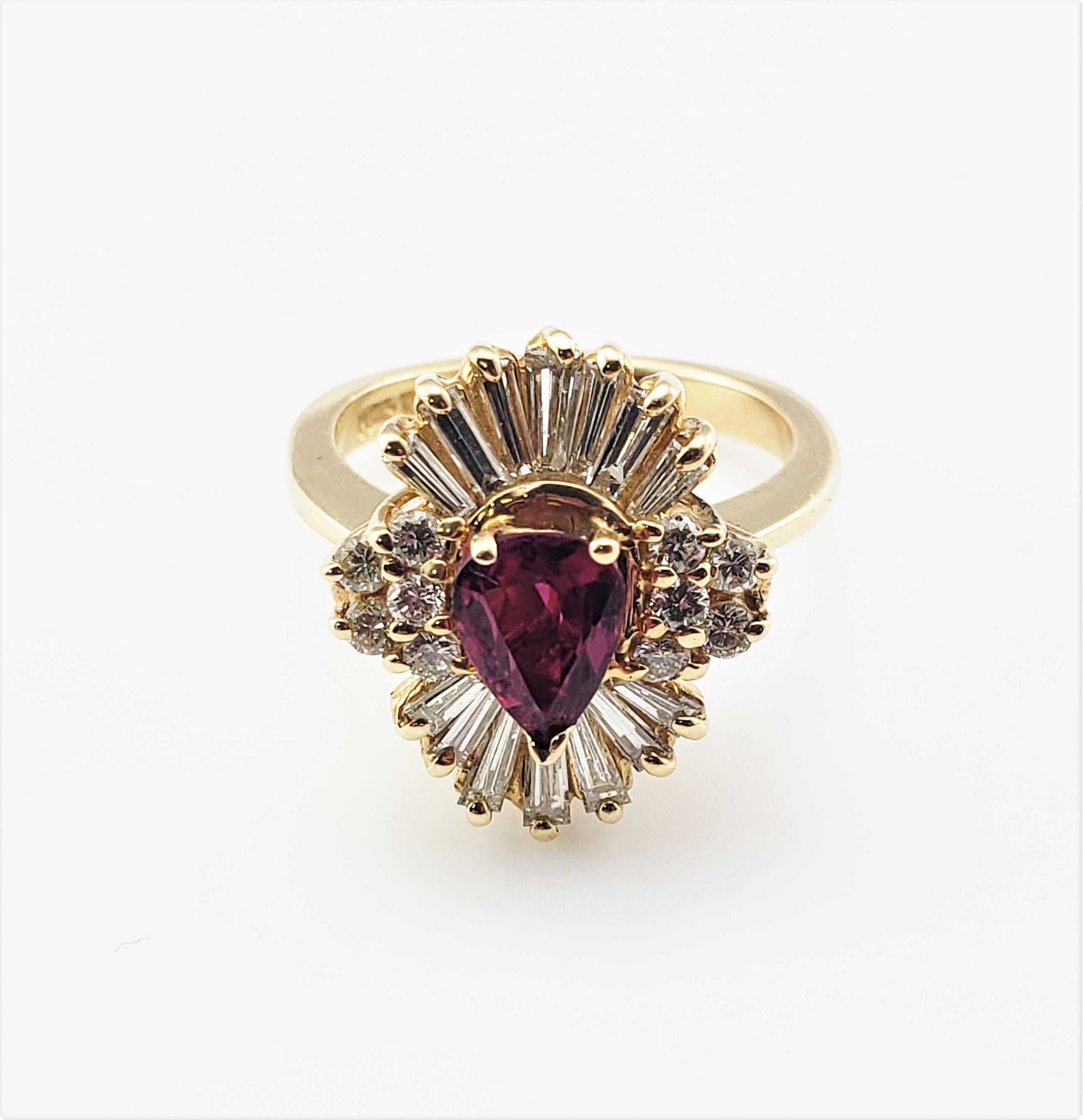 Vintage 14 Karat Yellow Gold Ruby and Diamond Ring Size 5 

This stunning ring features one pear shaped ruby (7 mm x 5 mm), ten round brilliant cut diamonds, 14 baguette diamonds set in 14K yellow gold.  Top of ring measures 16 mm x 13 mm.  Shank
