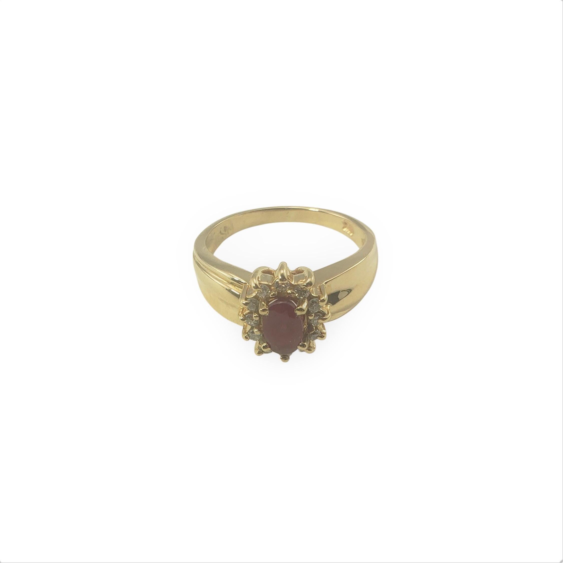 14 Karat Yellow Gold Ruby and Diamond Ring Size 5.5-

This lovely ring features one oval ruby (7 mm x 5 mm) surrounded by 12 round brilliant cut diamonds and set in 14K yellow gold.  Width:  10 mm.  Shank:  2 mm.  

Approximate total diamond weight:
