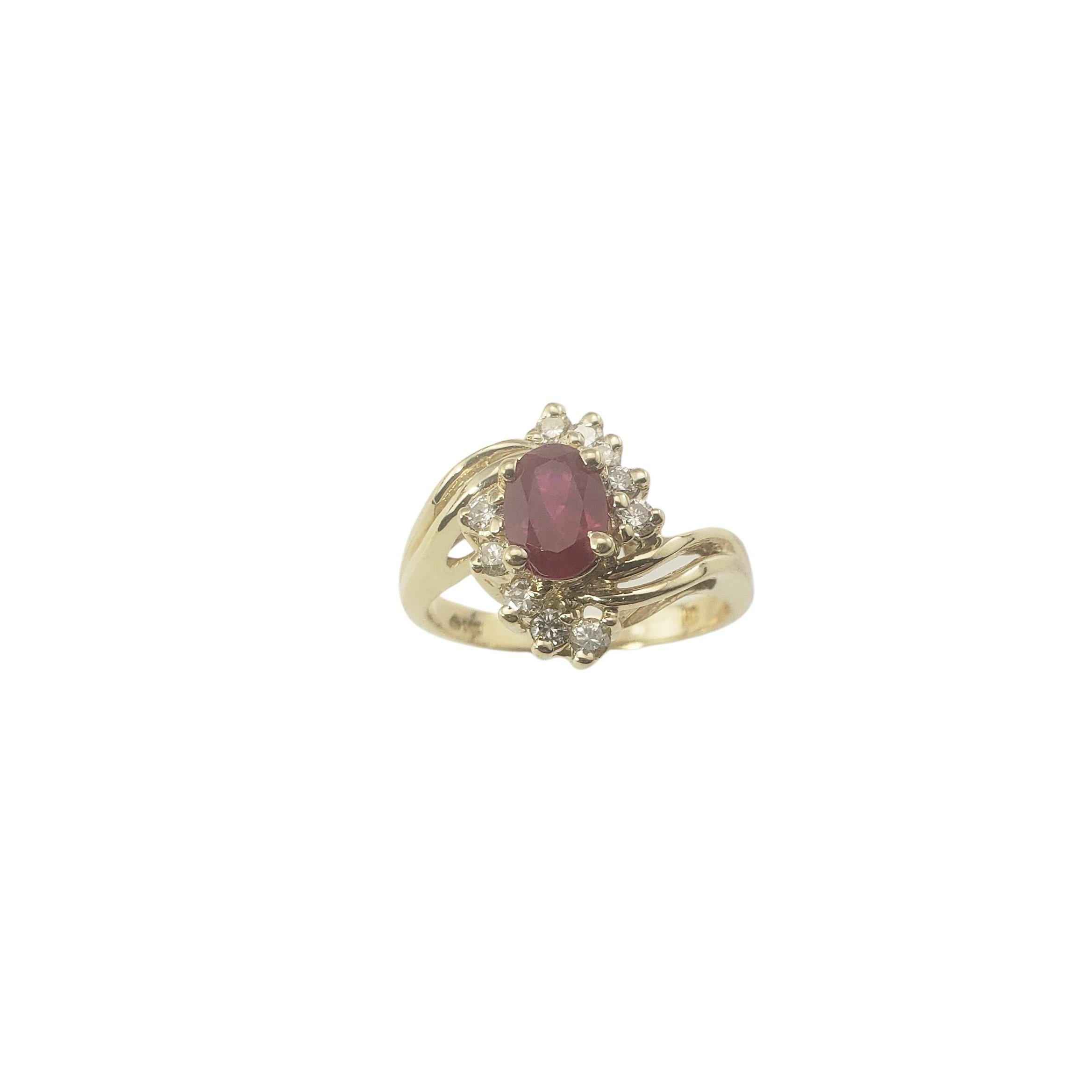 Vintage 14 Karat Yellow Gold Lab Created Ruby and Diamond Ring Size 6.75-

This lovely ring features one oval lab created ruby (7 mm x 5 mm) and ten round brilliant cut diamonds set in classic 14K yellow gold.  
Width:  13 mm.  Shank:  2