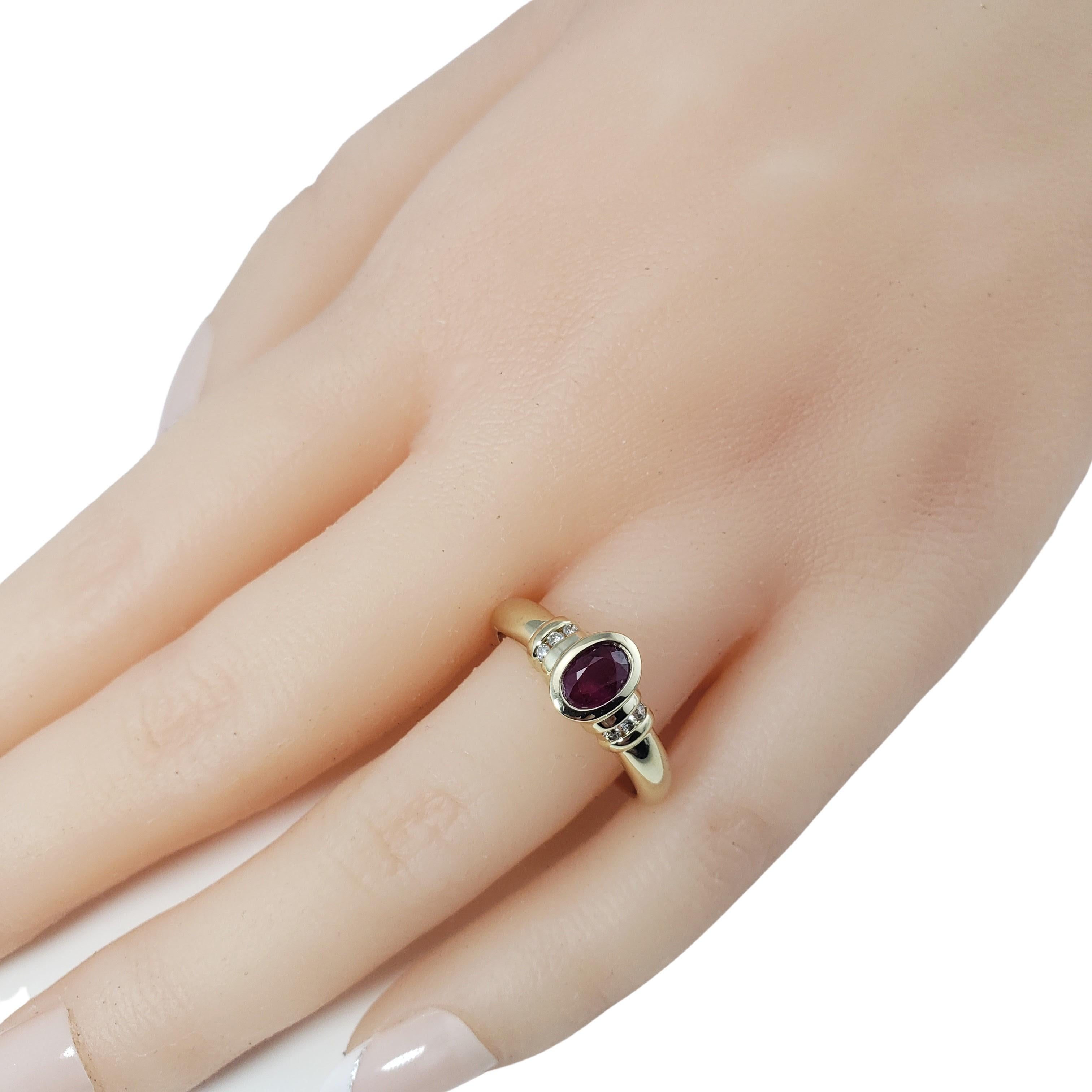 Vintage 14 Karat Yellow Gold Ruby and Diamond Ring Size 7.25-

This lovely ring features one oval ruby (6 mm x 5 mm) and six round brilliant cut diamonds set in classic 14K yellow gold.
Shank: 2 mm.

Approximate total diamond weight: .03