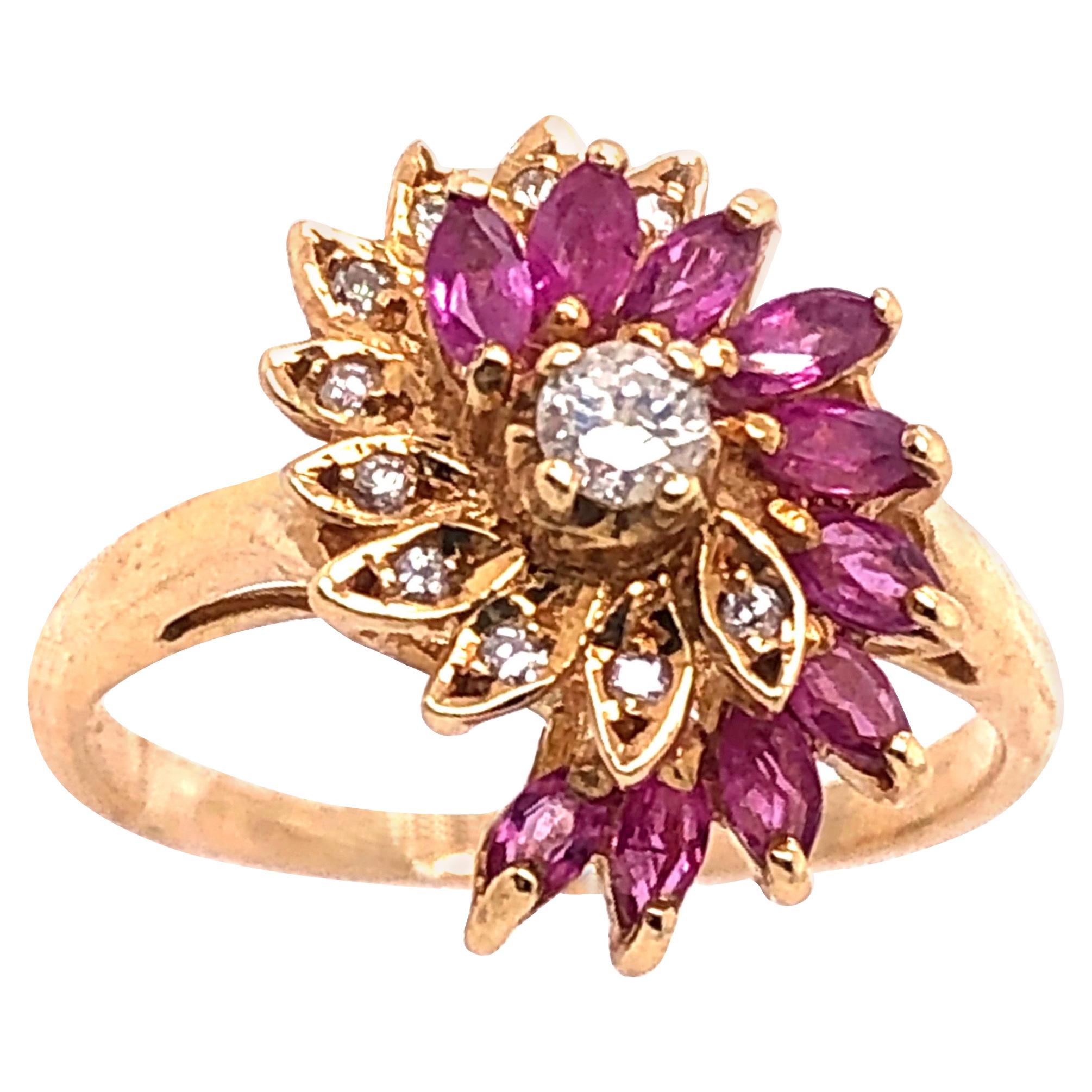 14 Karat Yellow Gold Ruby and Diamond Swirl Ring For Sale