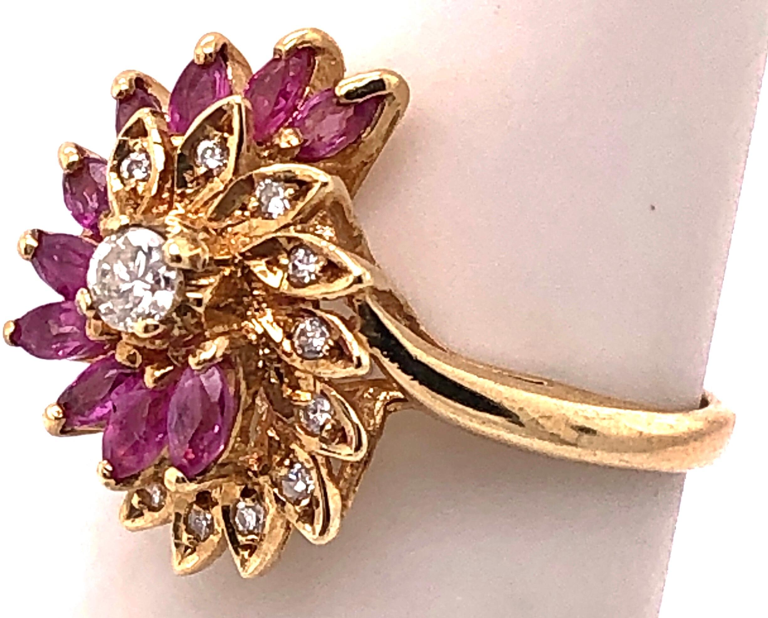 Modern 14 Karat Yellow Gold Ruby and Diamond Swirl Ring For Sale