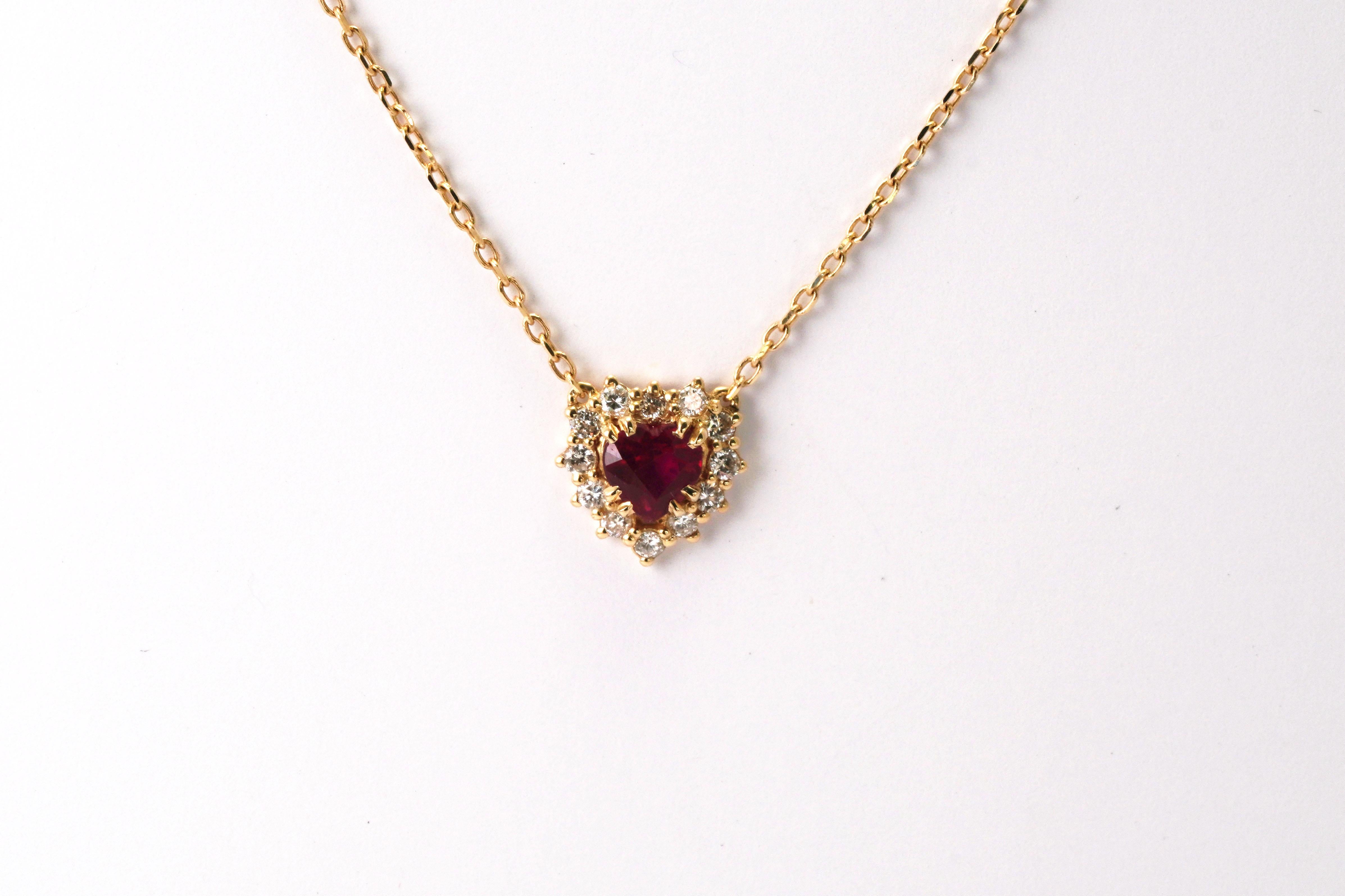 14 Karat Yellow Gold Diamond Ruby Necklace
Gold color: Yellow
Dimensions: 45cm in Length
Total weight: 3.58 grams

Set with:
- Ruby
Color: Red
Cut: Heart
Weight: 1.38 ct.
- Diamonds x 13
Cut: Brilliant
Weight: 0.24 ct.