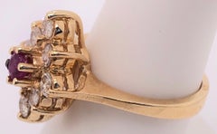 14 Karat Yellow Gold Ruby Center Framed In Diamonds Ring